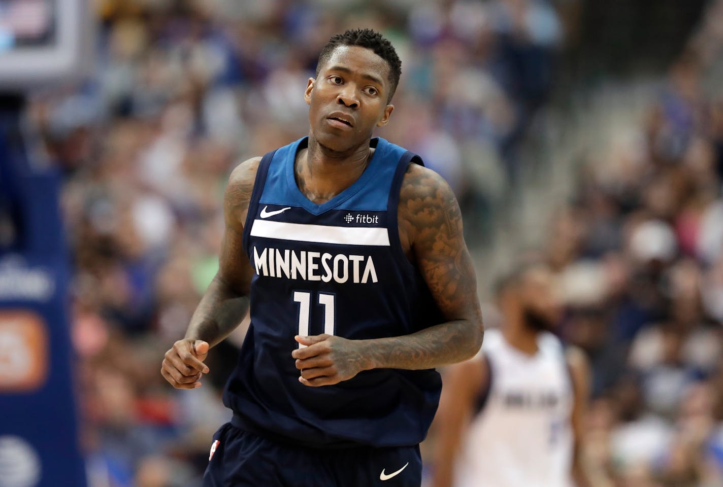 Minnesota Timberwolves' Jamal Crawford (11) jogs to the bench during an NBA basketball game against the Dallas Mavericks in Dallas, Friday, March 30, 2018. (AP Photo/Tony Gutierrez)