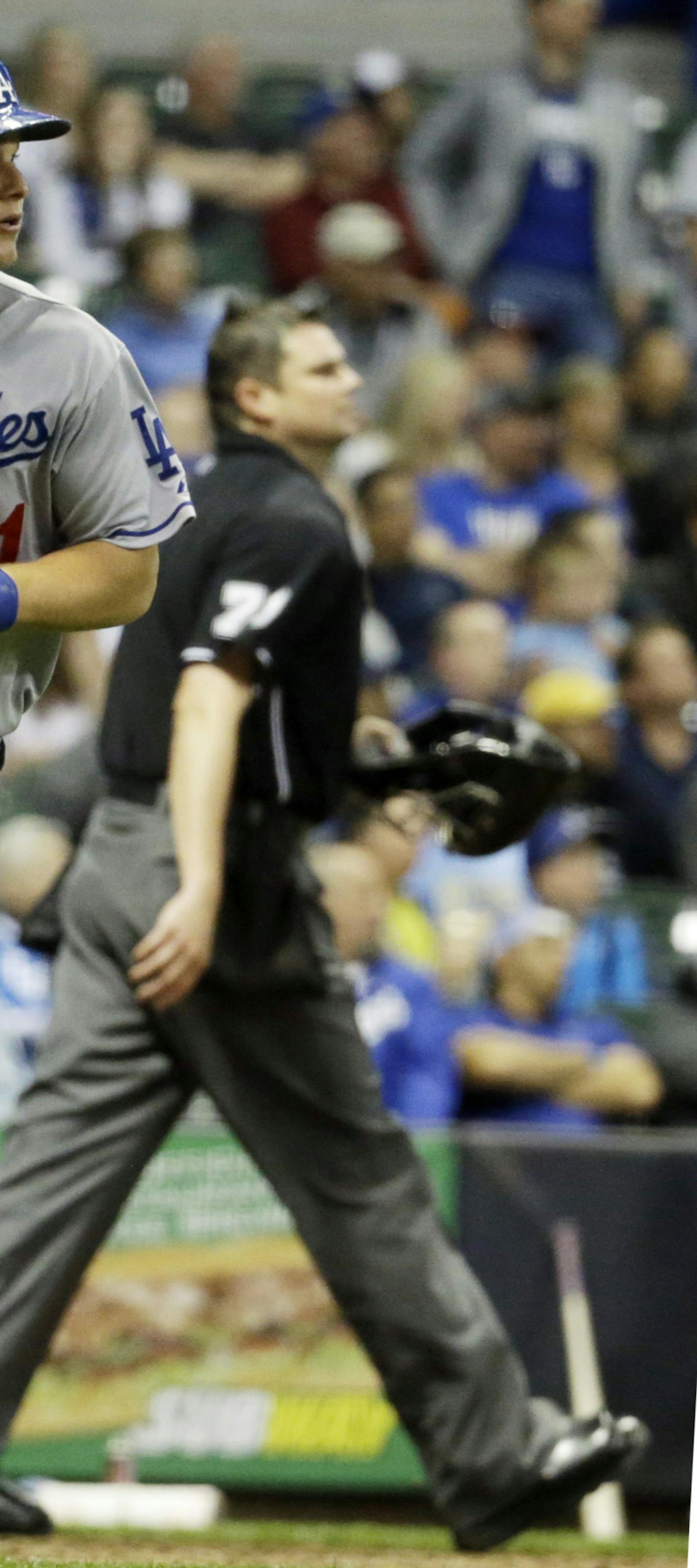 Los Angeles Dodgers' Joc Pederson watches his second home run of the night during the eighth inning of a baseball game against the Milwaukee Brewers Wednesday, May 6, 2015, in Milwaukee. (AP Photo/Morry Gash) ORG XMIT: WIMG112