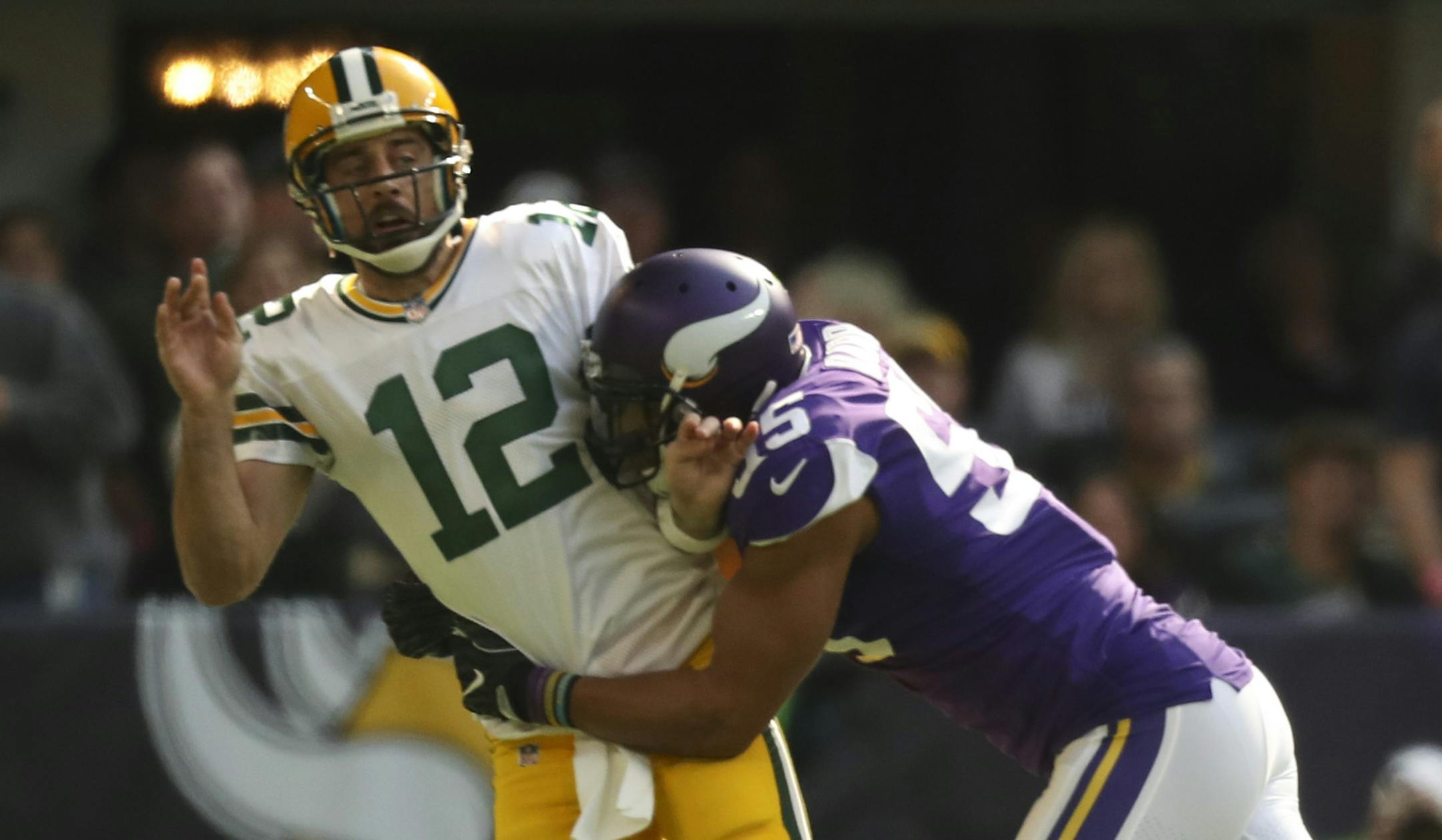 Green Bay Packers quarterback Aaron Rodgers (12) left the game after a hit on this play by Minnesota Vikings outside linebacker Anthony Barr (55) in the first quarter. ] JEFF WHEELER &#xef; jeff.wheeler@startribune.com The Minnesota Vikings met the Green Bay Packers in an NFL football game Sunday afternoon, October 15, 2017 at U.S. Bank Stadium in Minneapolis.