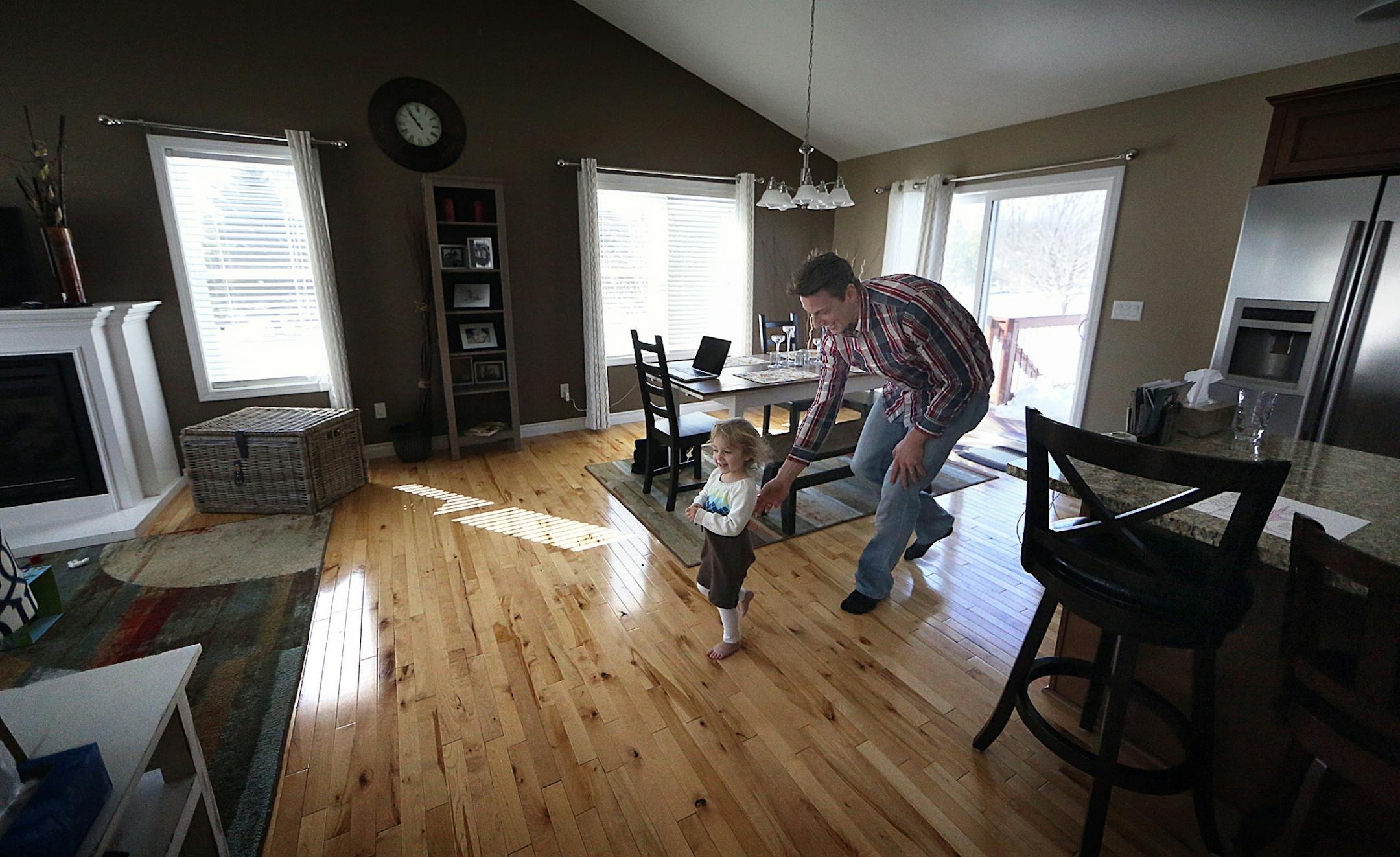 Jerrid Sebasta played with his daughter, Raiya, in the family�s home in Wilmar.