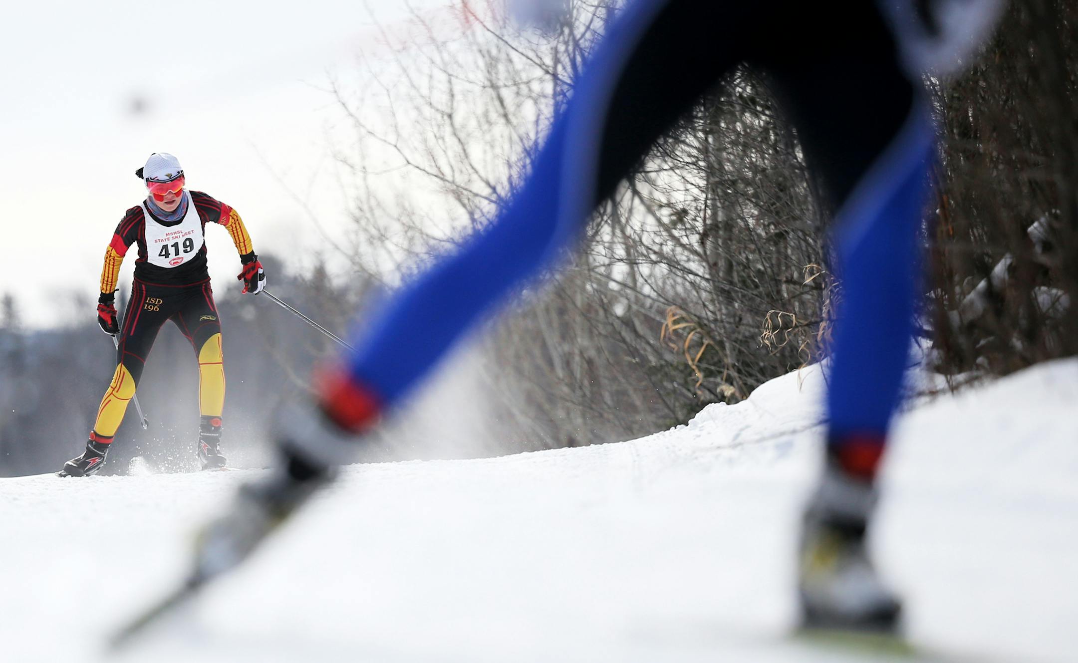 Girls overall winner Margie Freed, left, of Eastview chases a skier during the girls freestyle at the boys' and girls' Nordic Ski State Meet Thursday, Feb. 11, 2016, at Giants Ridge in Biwabik, MN.](DAVID JOLES/STARTRIBUNE)djoles@startribune.com high were seen during the boys' and girls' Nordic Ski State Meet Thursday, Feb. 11, 2016, at Giants Ridge in Biwabik, MN.
