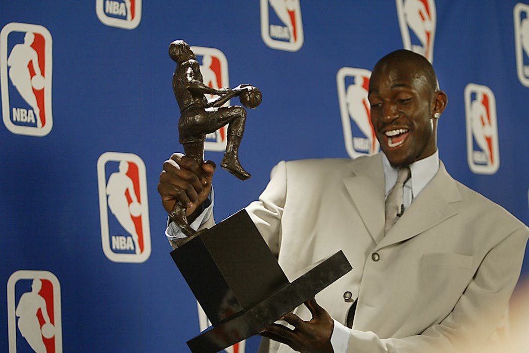 Kevin Garnett with his 2004 MVP trophy.