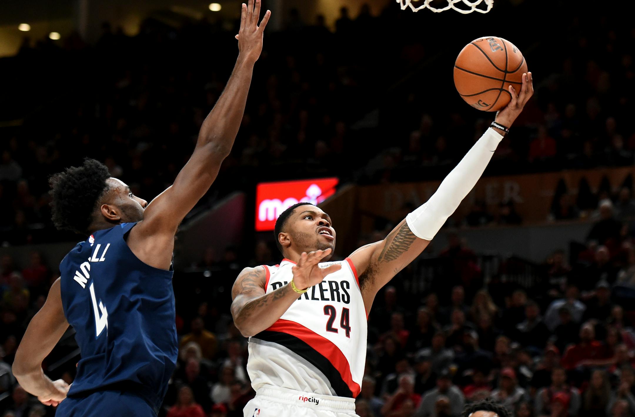 Portland Trail Blazers guard Kent Bazemore, right, drives to the basket next to Minnesota Timberwolves guard Jaylen Nowell during the second half of an NBA basketball game in Portland, Ore., Saturday, Dec. 21, 2019. The Blazers won 113-106. (AP Photo/Steve Dykes)