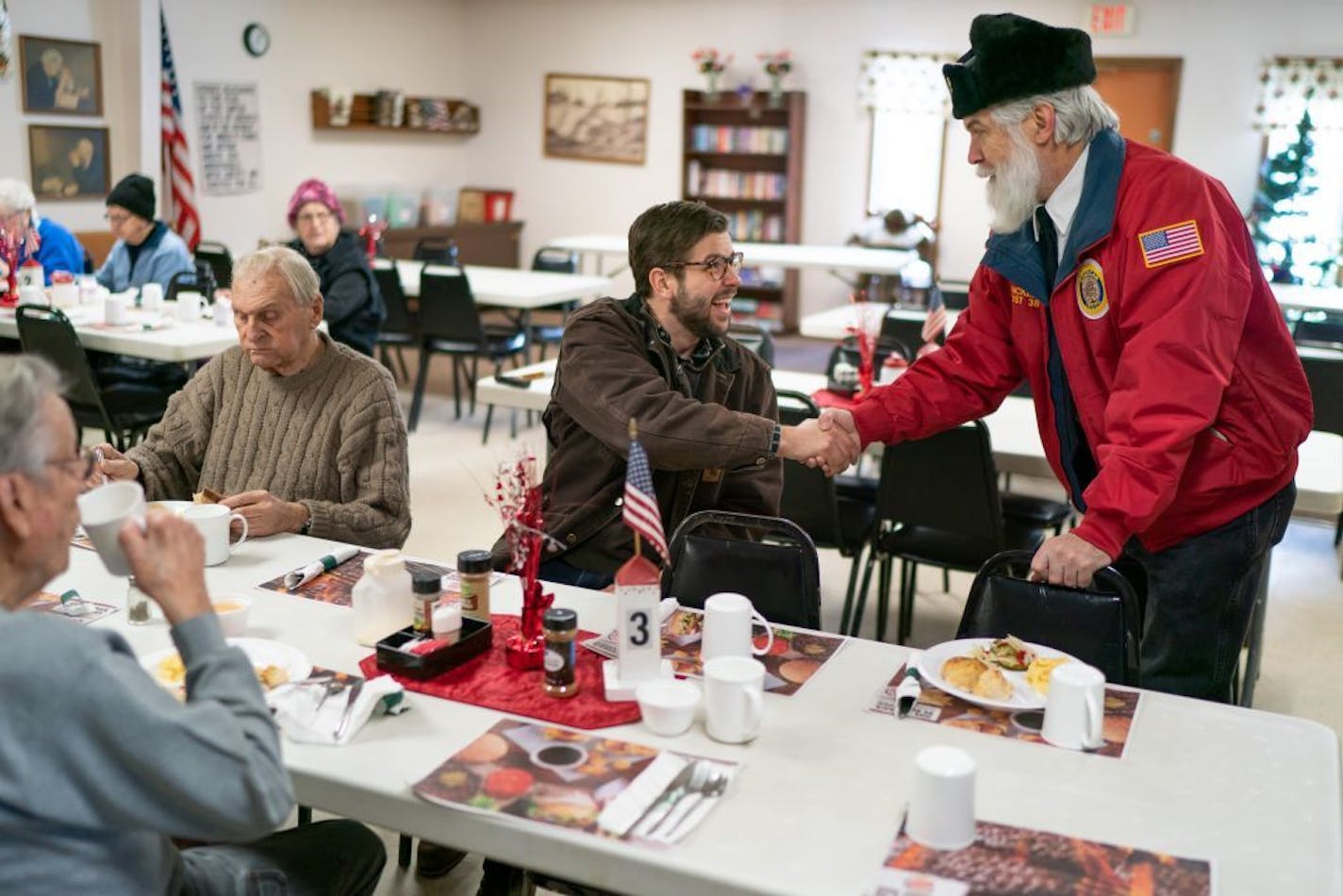 Stu Lourey, DFL candidate for State Senate in the SD11 special election, greeted Jim Klatt at a senior center in Hinkley.