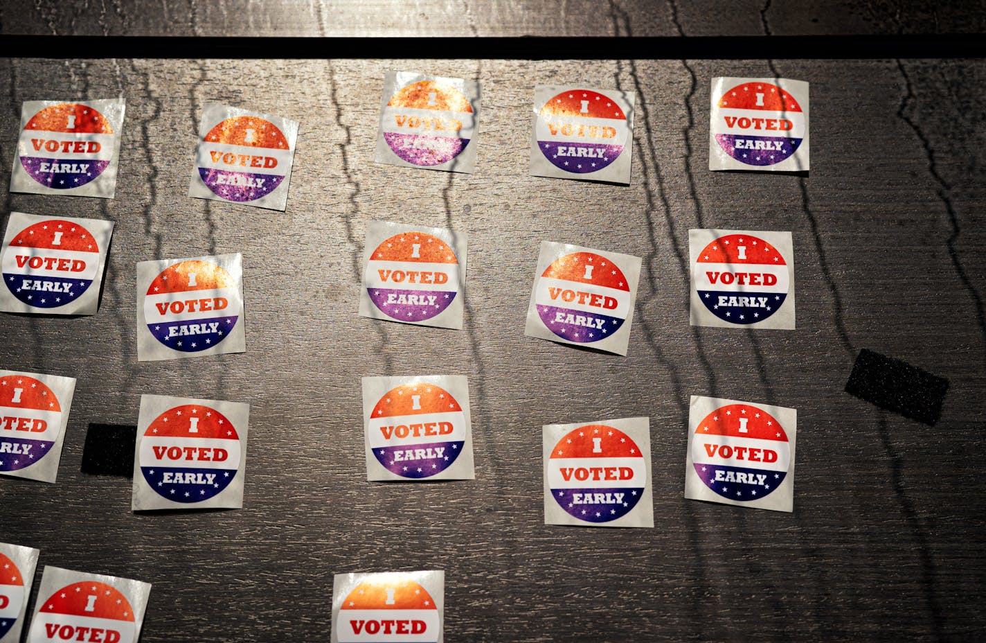 Every voter who comes in the Minnesota Early Vote Center received an I Voted Early sticker. The lines are from window condensation caused by the air conditioning in the center. ] GLEN STUBBE • glen.stubbe@startribune.com Wednesday, July 29, 2020