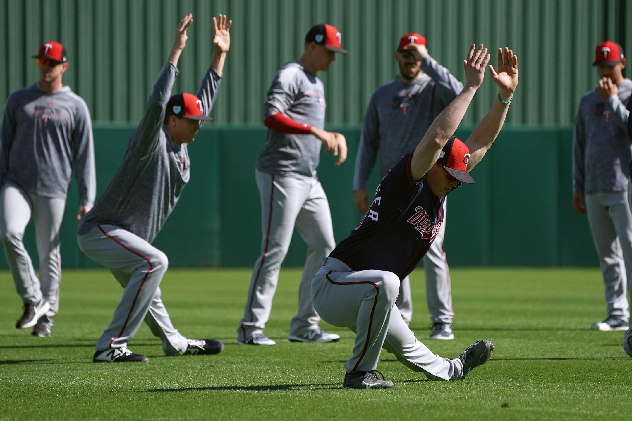 Twins pitcher Trevor Hildenberger (39) stretched with his fellow pitchers in the outfield of Hammond Stadium before taking to the bullpen Thursday morning.
