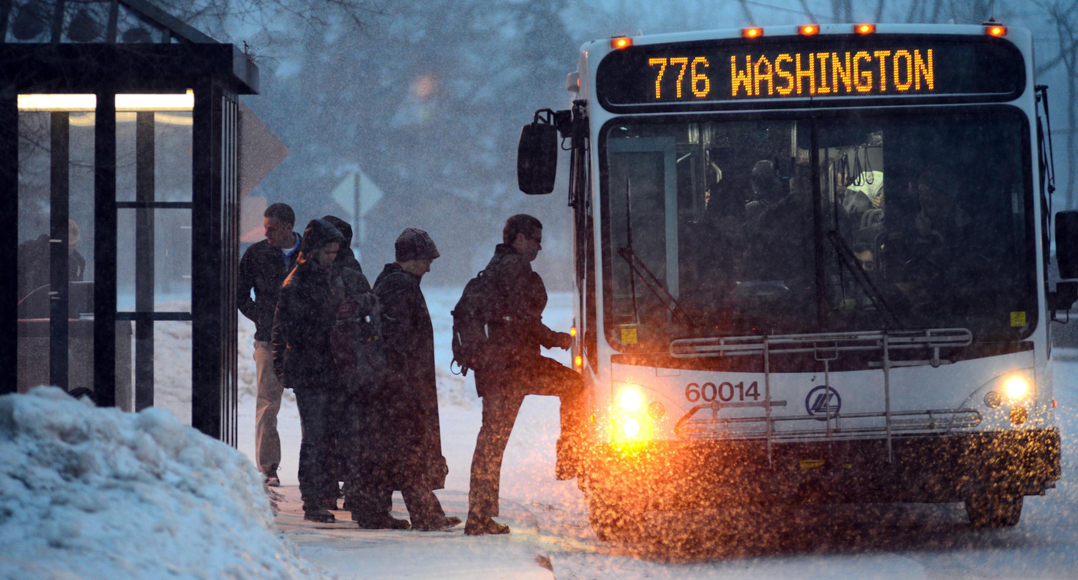 Snow is expected to fall through Tuesday, making Monday morning and evening commutes a challenge. A midafternoon lull is expected. Commuters boarded this Plymouth Metro Link bus in Plymouth at a park in ride in Plymouth, Minn..] Richard.Sennott@startribune.com Richard Sennott/Star Tribune. , Plymouth Minn. Monday3/4/13) ** (cq)