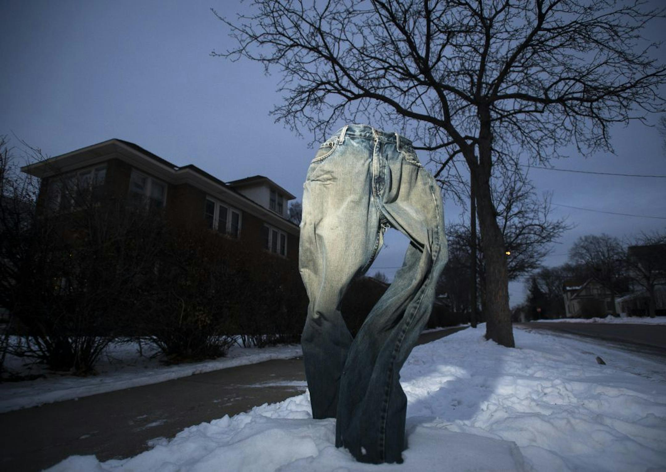 A pair of frozen blue jeans are on display at the intersection of 16th Avenue Northeast and 2nd Street Northeast on Tuesday, Jan. 19, 2016 in Minneapolis, Minn. The jeans were put out by Randall Johnson, of Minneapolis, a former student of MCAD.