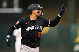 The Twins' Royce Lewis celebrates his home run against the Athletics at Oakland Coliseum on Friday.