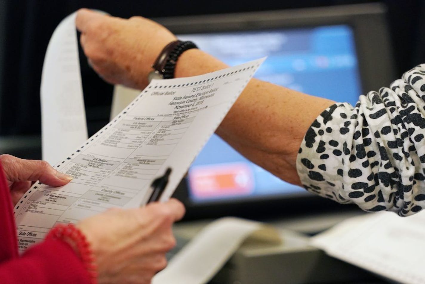 Election judges Mary Wickersham, left, and Mary Maynard, right, worked on the mandatory public testing of St. Louis Park's voter machines ahead of the upcoming midterm elections on Oct. 24, 2018.