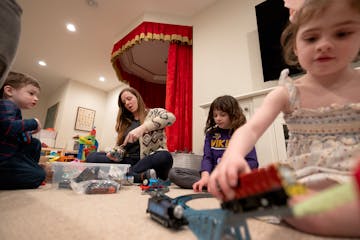 Nanny Faith Black-Tschida (middle) played with Caleb, 3, Ella, 7, and Alice, 5 at their home in Edina on a recent day. Their mother, Sarah Wilson, fou