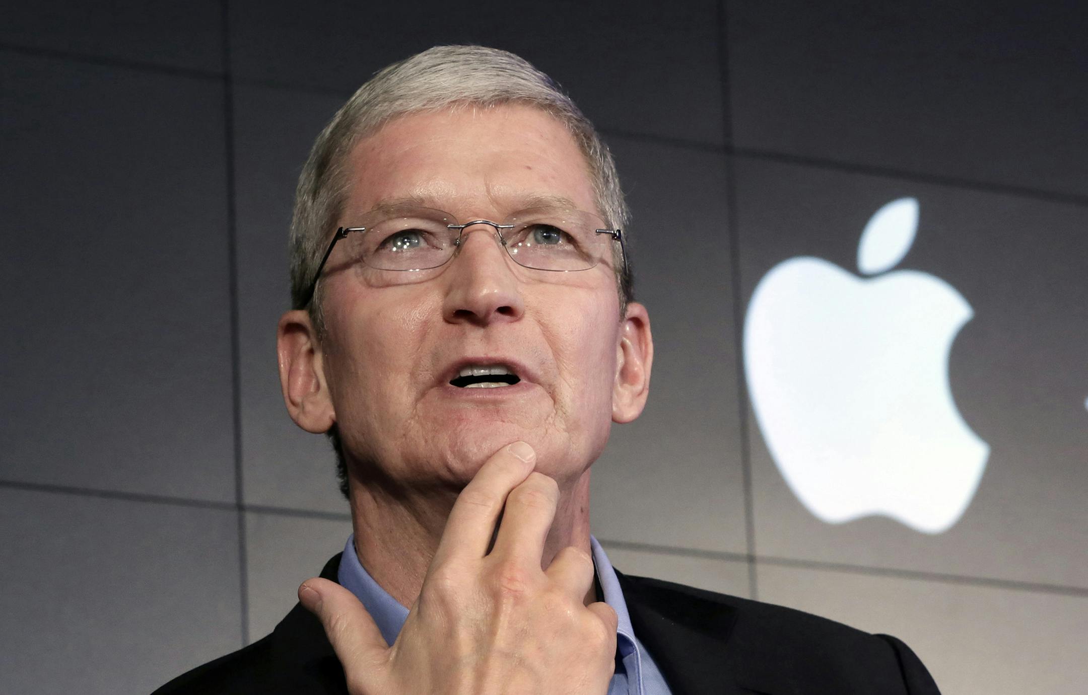 FILE - In this April 30, 2015, file photo, Apple CEO Tim Cook responds to a question during a news conference at IBM Watson headquarters, in New York. Cook said his company will resist a federal magistrate's order to hack its own users in connection with the investigation of the San Bernardino, Calif., shootings. In a statement posted early Wednesday, Feb. 17, 2016, on the company's website, Cook argued that such a move would undermine encryption by creating a backdoor that could potentially be