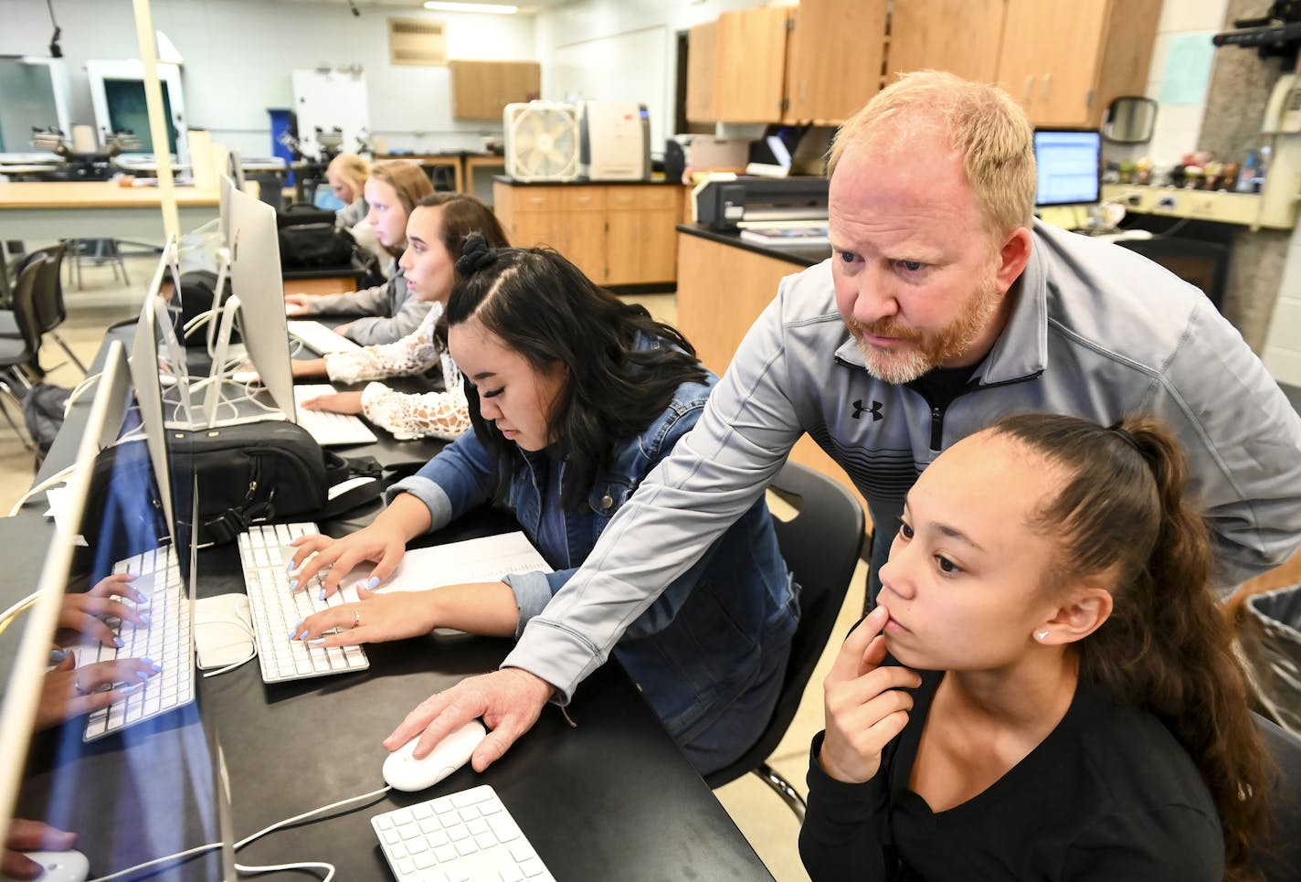 Anoka High School photography and graphic design teacher Paul Heida helped sophomore Ebony Elliott, bottom right, with an issue she was having with her illustration software during yearbook class Tuesday afternoon. ] Aaron Lavinsky &#xa5; aaron.lavinsky@startribune.com Last year, statewide high school graduation rates hit a record high - with nearly 83 percent earning their diploma on time. But progress stalled this year in narrowing the wide gap between students of color and their white peers.