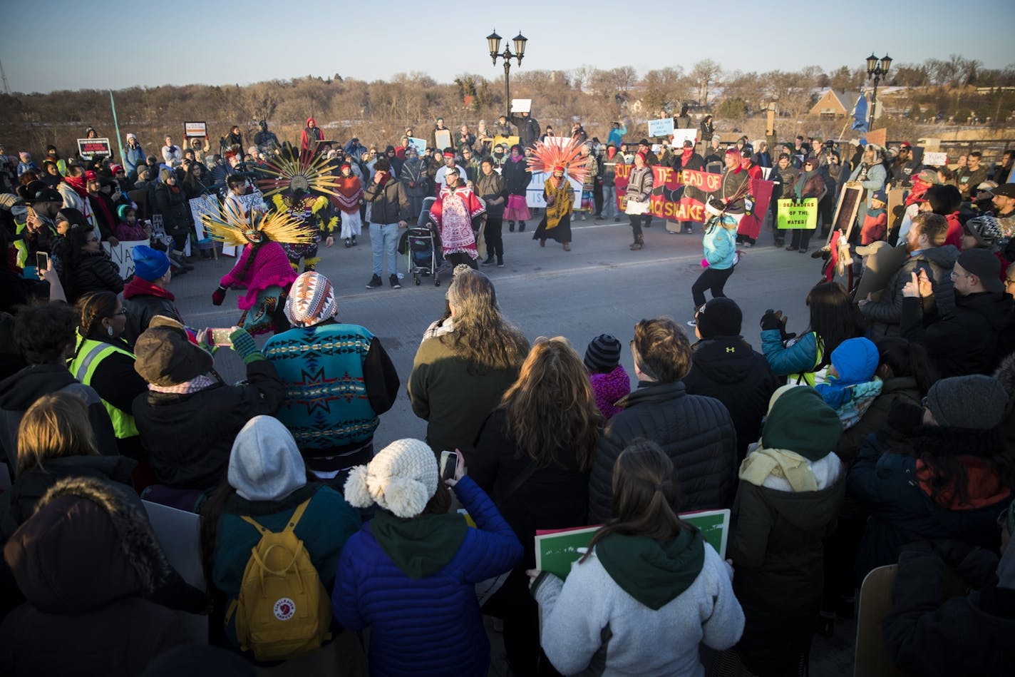 Close to 500 people gathered in the middle of the Marshall Avenue Bridge (Lake Street) to protest the Dakota Access Pipeline in Minneapolis and St. Paul, Minn., on Friday, January 27, 2016. In the center of the crowd were dancers and speakers.