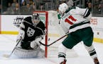 Kings goaltender Jack Campbell deflects a shot by Wild left wing Zach Parise during the first period last week. Parise later scored.