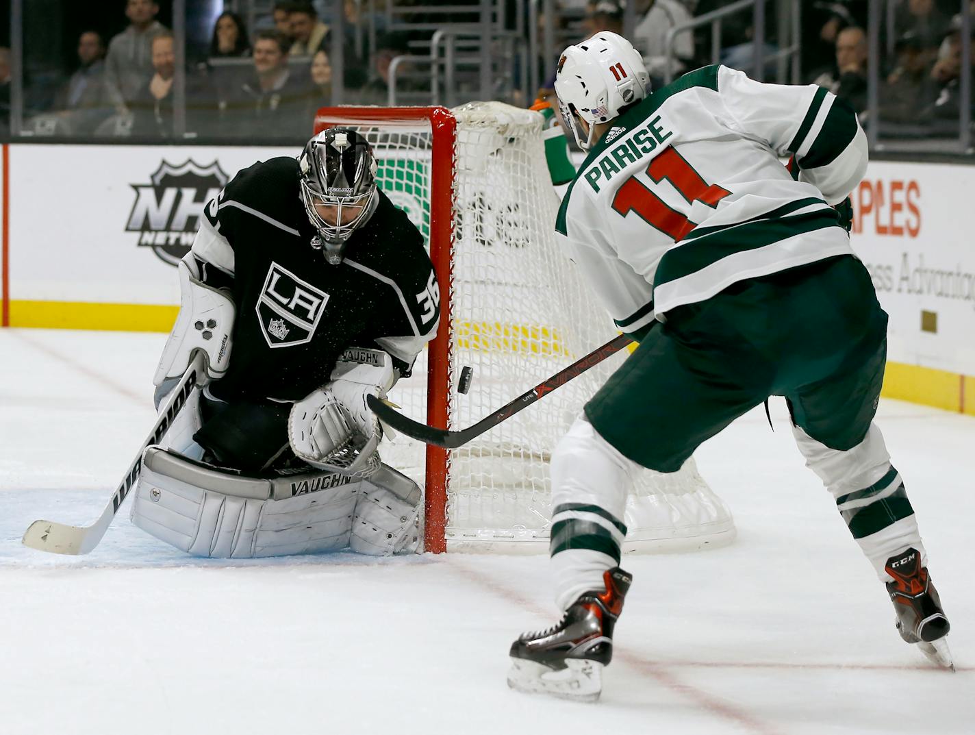 Kings goaltender Jack Campbell deflects a shot by Wild left wing Zach Parise during the first period last week. Parise later scored.