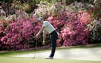 Rory McIlroy, of Northern Ireland, watches his putt on the 13th hole during a practice round for the Masters golf tournament Monday, April 8, 2019, in