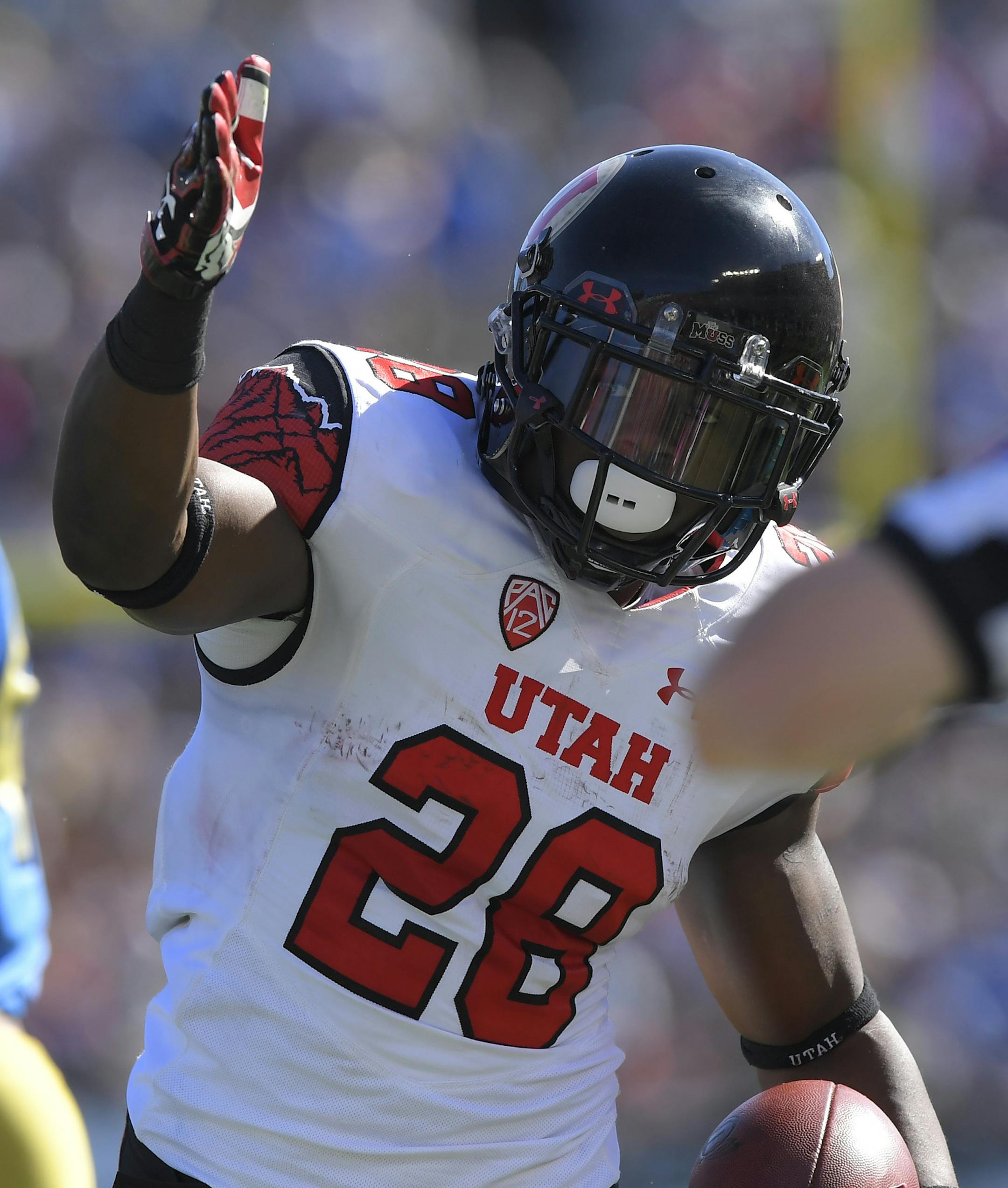 Utah running back Joe Williams celebrates after making a first down during the first half of an NCAA college football game against UCLA, Saturday, Oct. 22, 2016, in Pasadena, Calif. (AP Photo/Mark J. Terrill)