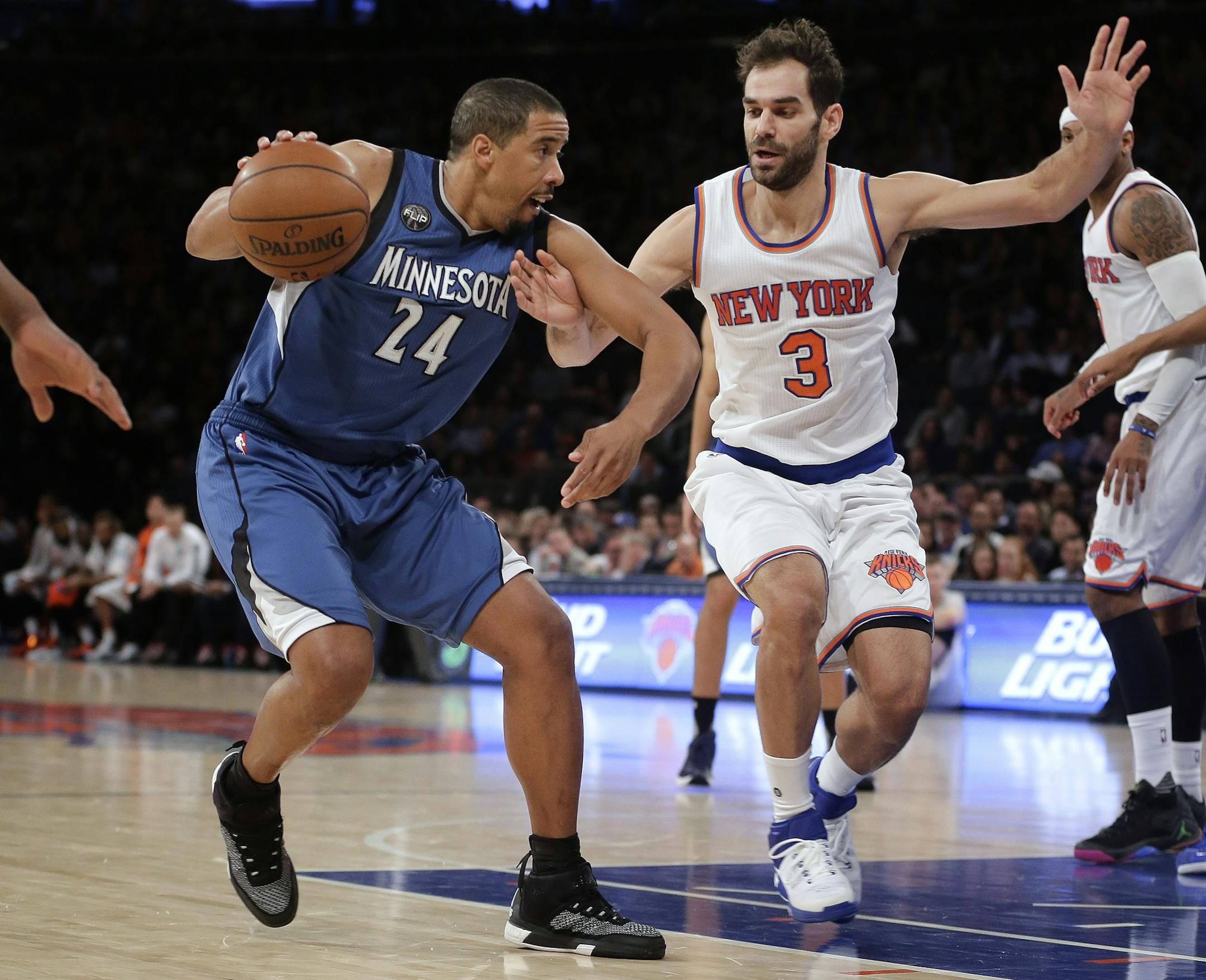 Minnesota Timberwolves guard Andre Miller (24) drives against New York Knicks guard Jose Calderon (3) during the first quarter of an NBA basketball game Wednesday, Dec. 16, 2015, in New York. (AP Photo/Julie Jacobson)