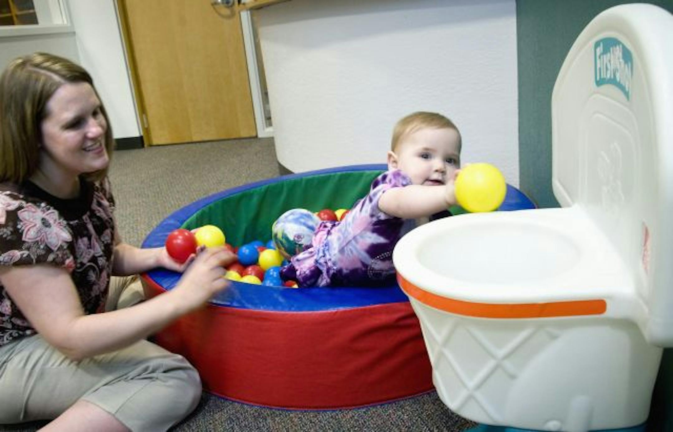 Shelly Dvorak visited her 8-month-old daughter Ashlyn at General Mills infant daycare over the lunch hour.
