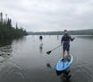 Members of the Minnesota-Duluth recreation program paddleboarded in Up North in summer 2018.
