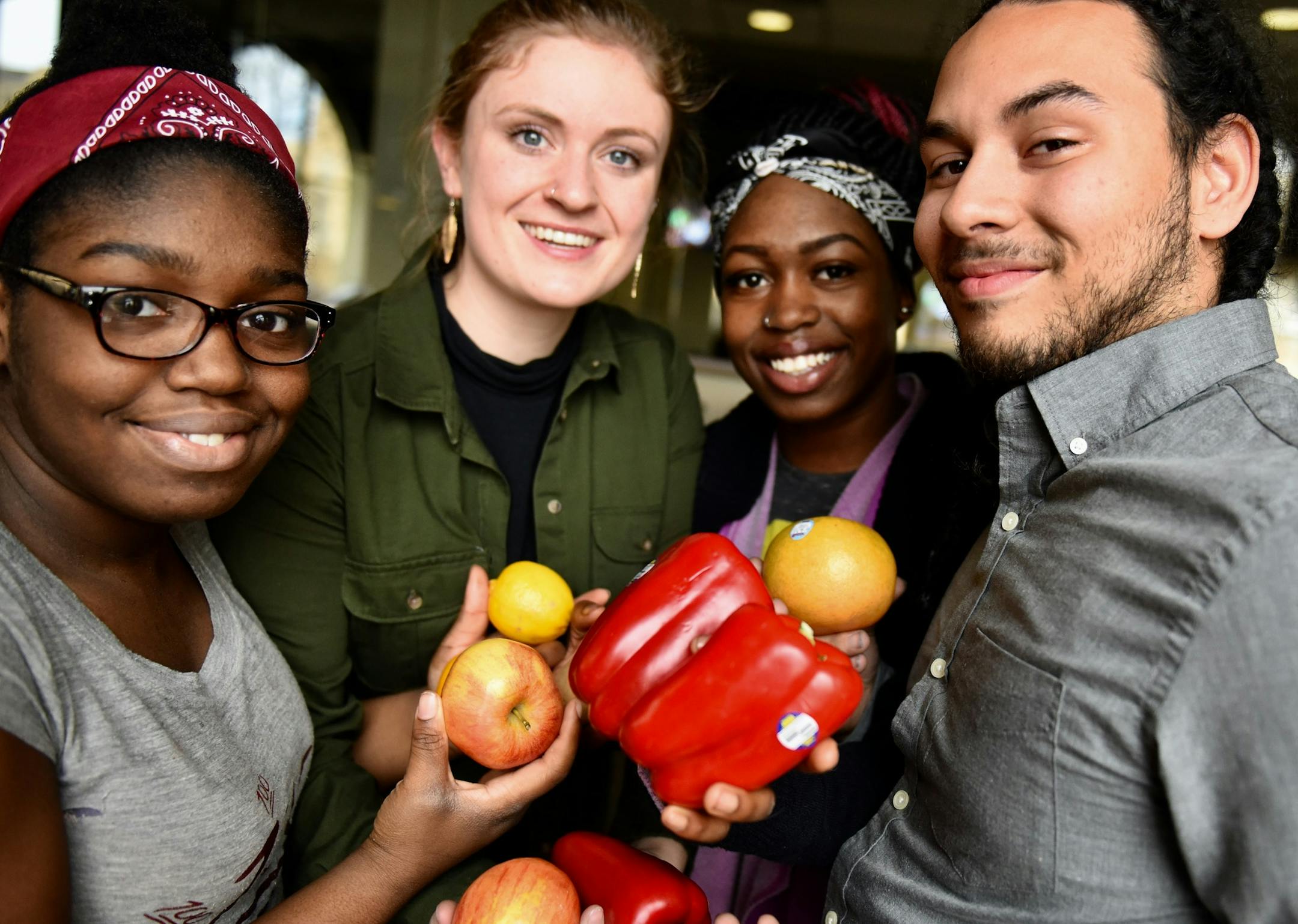 BrightSide Produce 1: Young people involved in BrightSide Produce, including Adam Pruitt (right) and Demetria Fuller (second from right), who co-founded BrightSide Produce with University of St. Thomas professor Adam Kay. (Mychaela Bartel/ThreeSixty Journalism)
