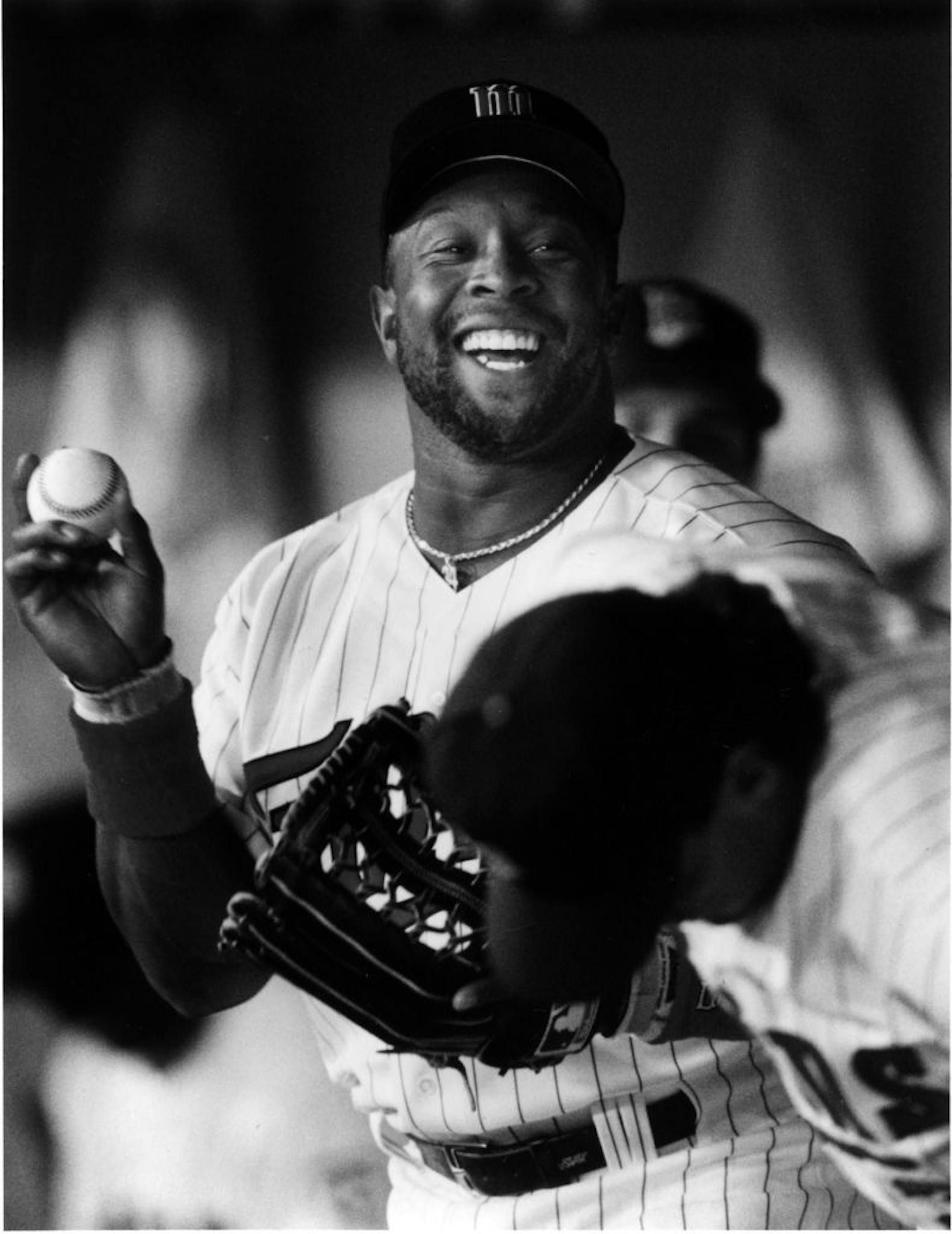 Kirby Puckett was all smiles as he joked with other Minnesota Twins players before the season opener at the Metrodome, April 6, 1993. Star Tribune photo by Bruce Bisping.