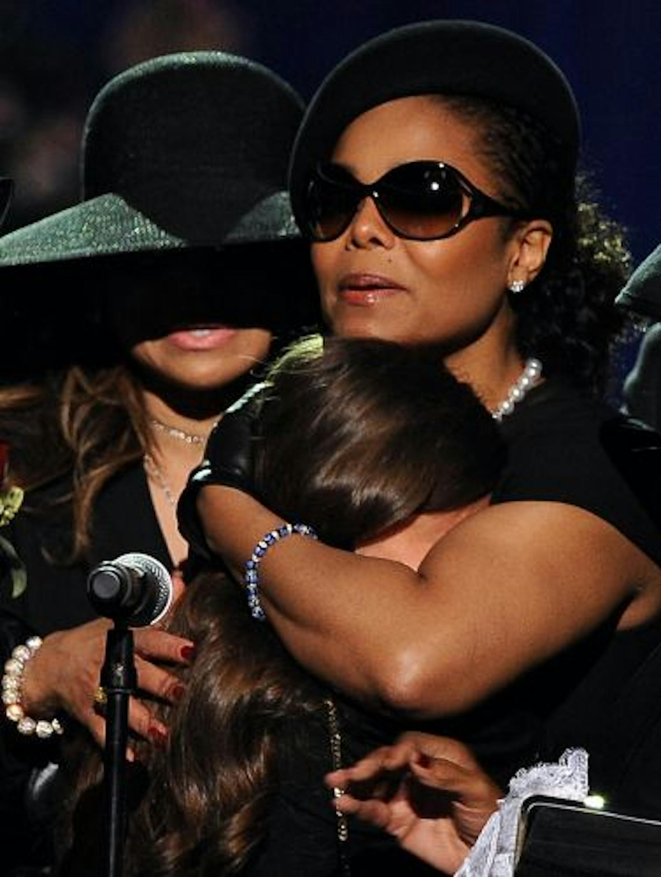 LOS ANGELES, CA - JULY 07: Michael Jackson's daughter Paris Michael Katherine Jackson is conforted by her aunts Janet Jackson (R) and LaToya Jackson during the Michael Jackson public memorial service held at Staples Center on July 7, 2009 in Los Angeles, California. Jackson, the iconic pop star, died at the age of 50 at UCLA Medical Center after going into cardiac arrest at his rented home on June 25 in Los Angeles.