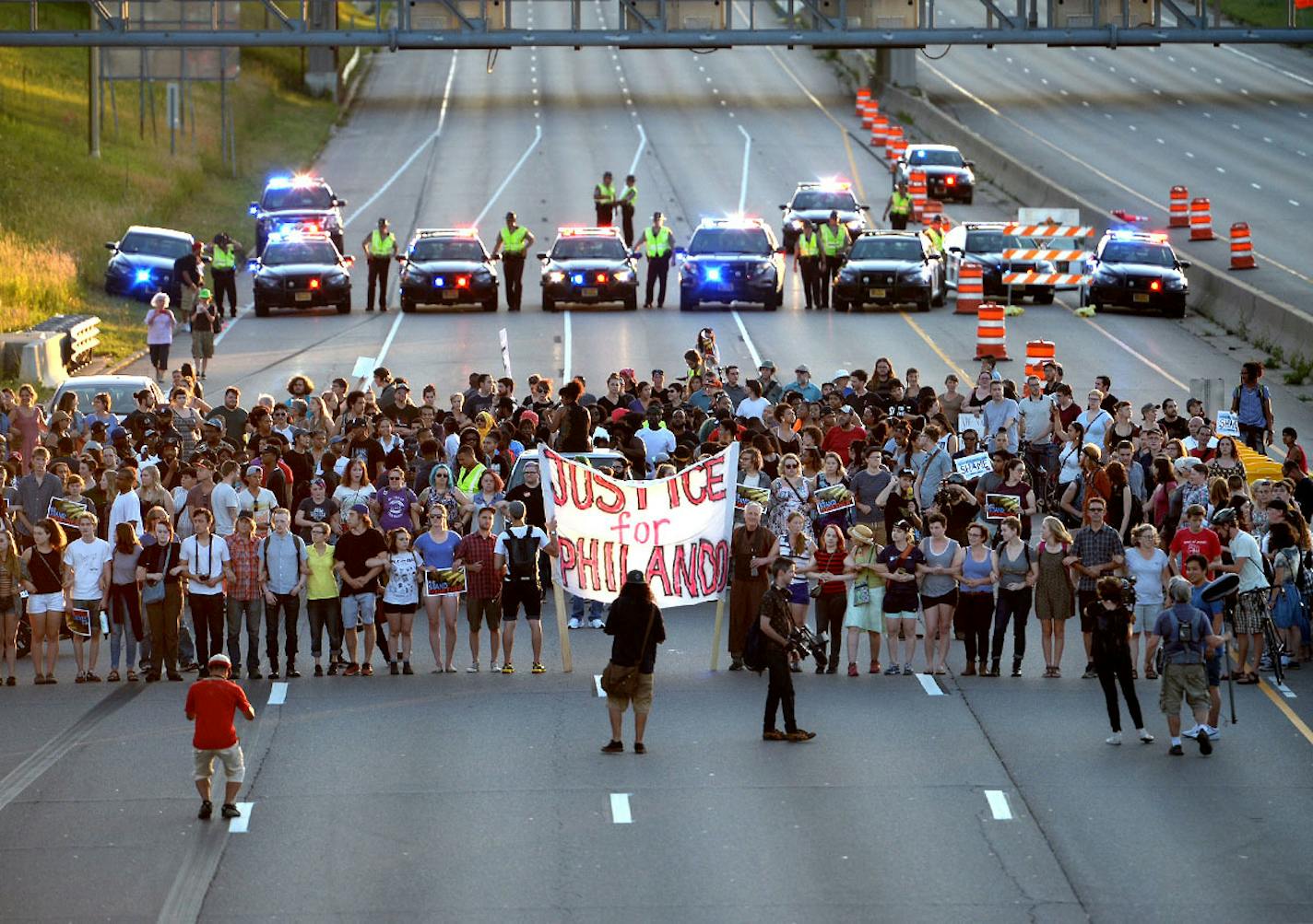 Marchers protesting the Wednesday night shooting death of Philando Castile by police have blocked part of Interstate 94 west of downtown St. Paul Saturday evening.