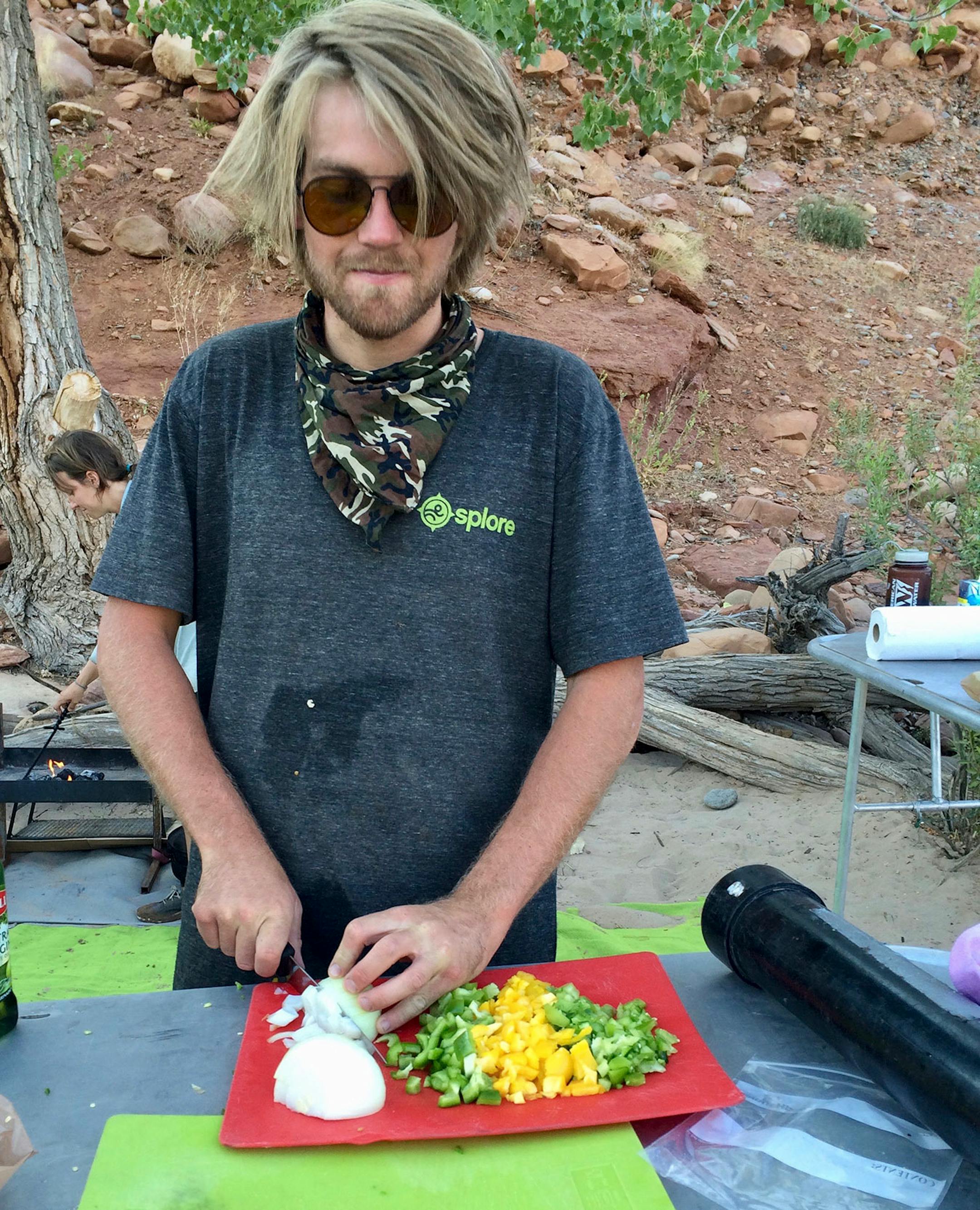 Splore's Lucien Blakemore prepares a riverside meal in Splore's camp kitchen.
