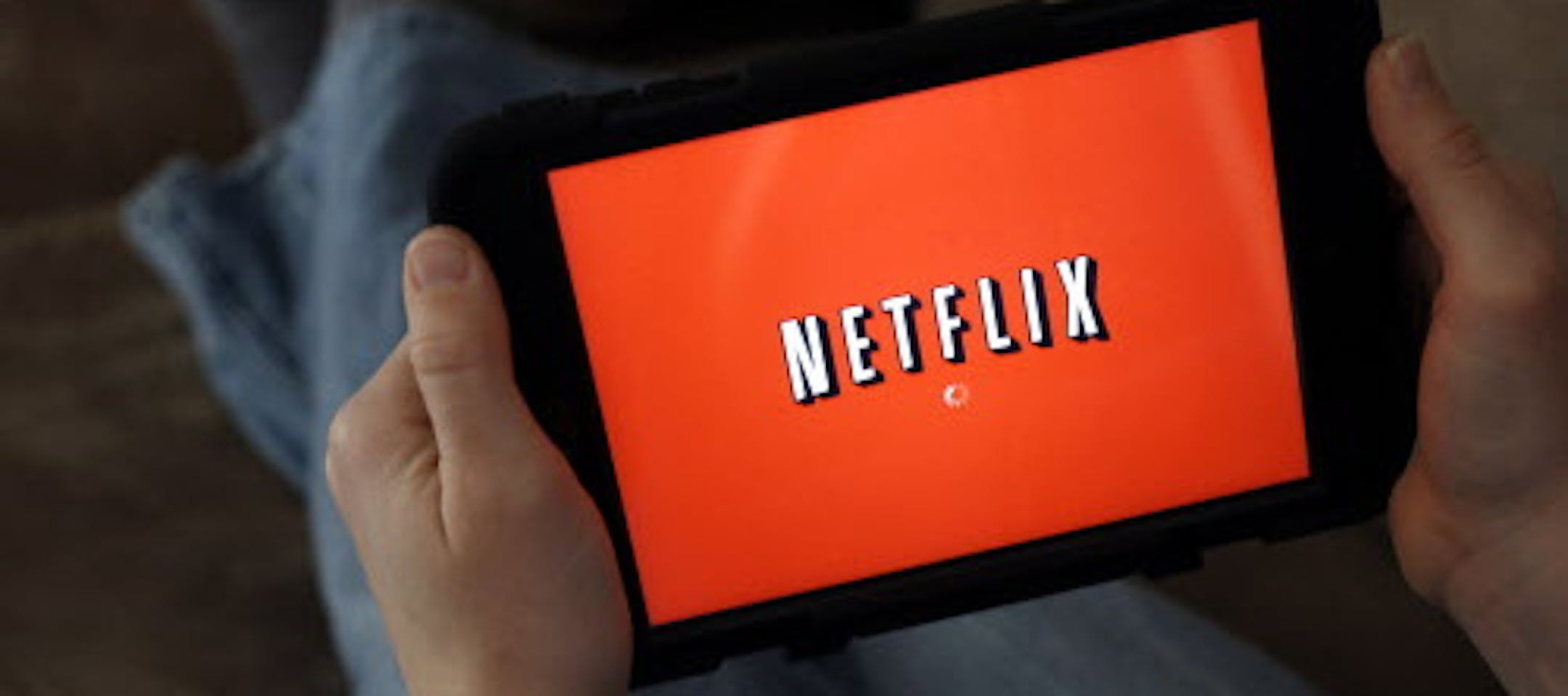 FILE - In this Friday, Jan. 17, 2014, file photo, a person displays Netflix on a tablet in North Andover, Mass. Netflix subscribers can now download shows and movies to watch later when theyíre not online, like during a flight or car. The download option was added to phone and tablet apps Wednesday, Nov. 30, 2016. (AP Photo/Elise Amendola, File)