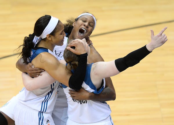 From left, Minnesota Lynx forward Maya Moore (23), forward Rebekkah Brunson (32) and guard Lindsay Whalen (13) celebrated after defeating Indiana in t