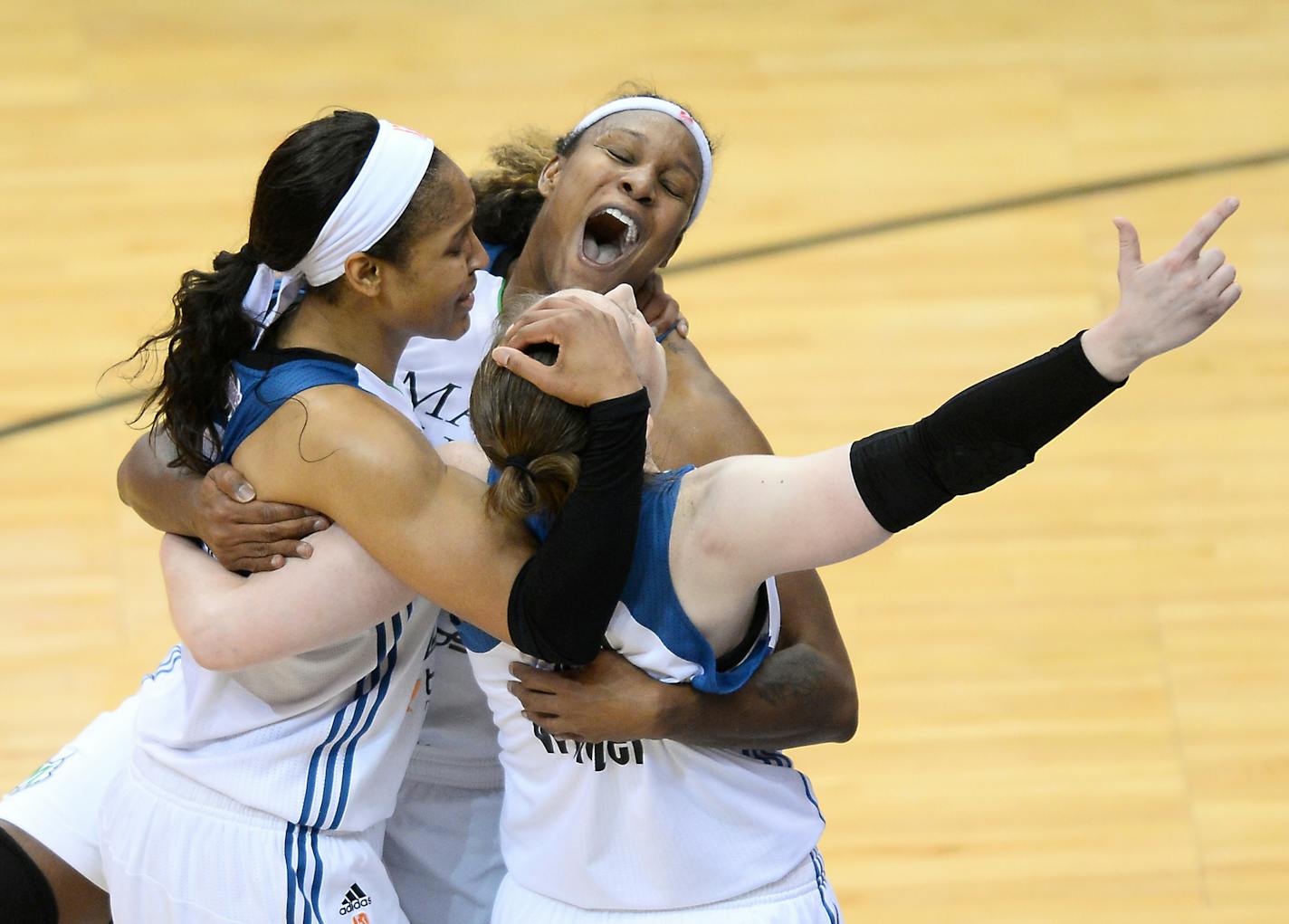 From left, Minnesota Lynx forward Maya Moore (23), forward Rebekkah Brunson (32) and guard Lindsay Whalen (13) celebrated after defeating Indiana in the WNBA Finals in October.