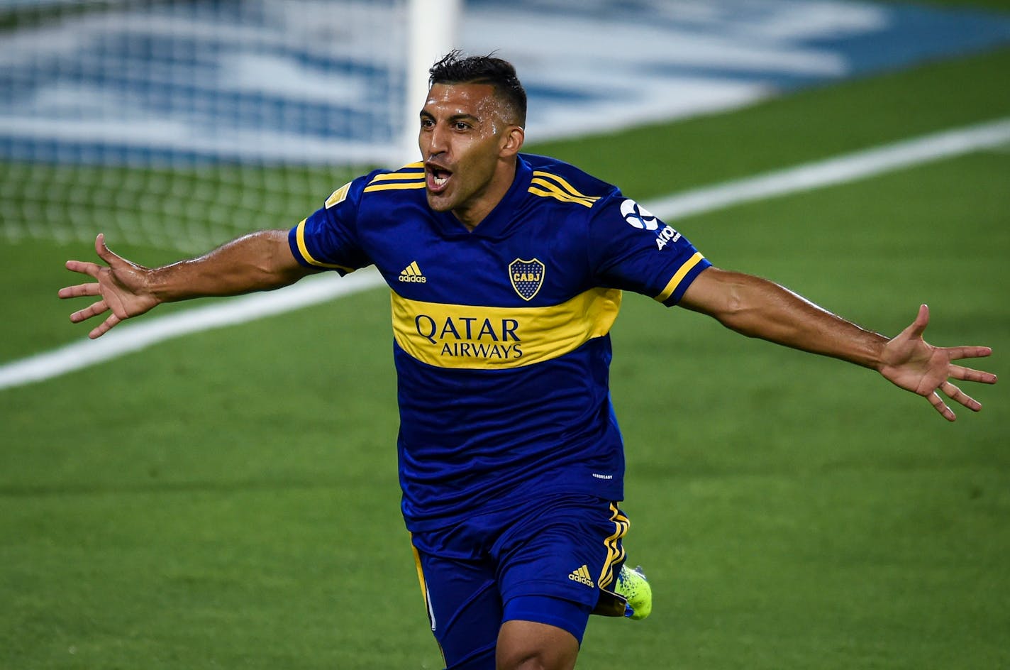 Ramon Abila of Boca Juniors celebrates after scoring the opening goal against River Plate during a Copa Diego Maradona soccer match hat the Bombonera stadium in Buenos Aires, Argentina, Saturday, Jan. 2, 2021. (AP Photo/Marcelo Endelli/Pool)