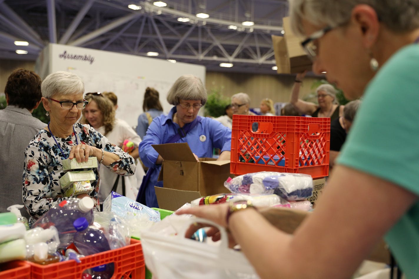 LeeAnn Baker from Marcell, Minn., left, and Marilyn Martell from Mason City, Iowa, center, helped fill bags with toiletry items to be given to people in need as they participated in special volunteer projects. ] ANTHONY SOUFFLE &#xef; anthony.souffle@startribune.com More than 3,000 Lutheran women from across the globe gathered at the Minneapolis Convention center this week for the triennial gathering of the Women of the Evangelical Lutheran Church of America Friday, July 14, 2017 in Minneapolis.