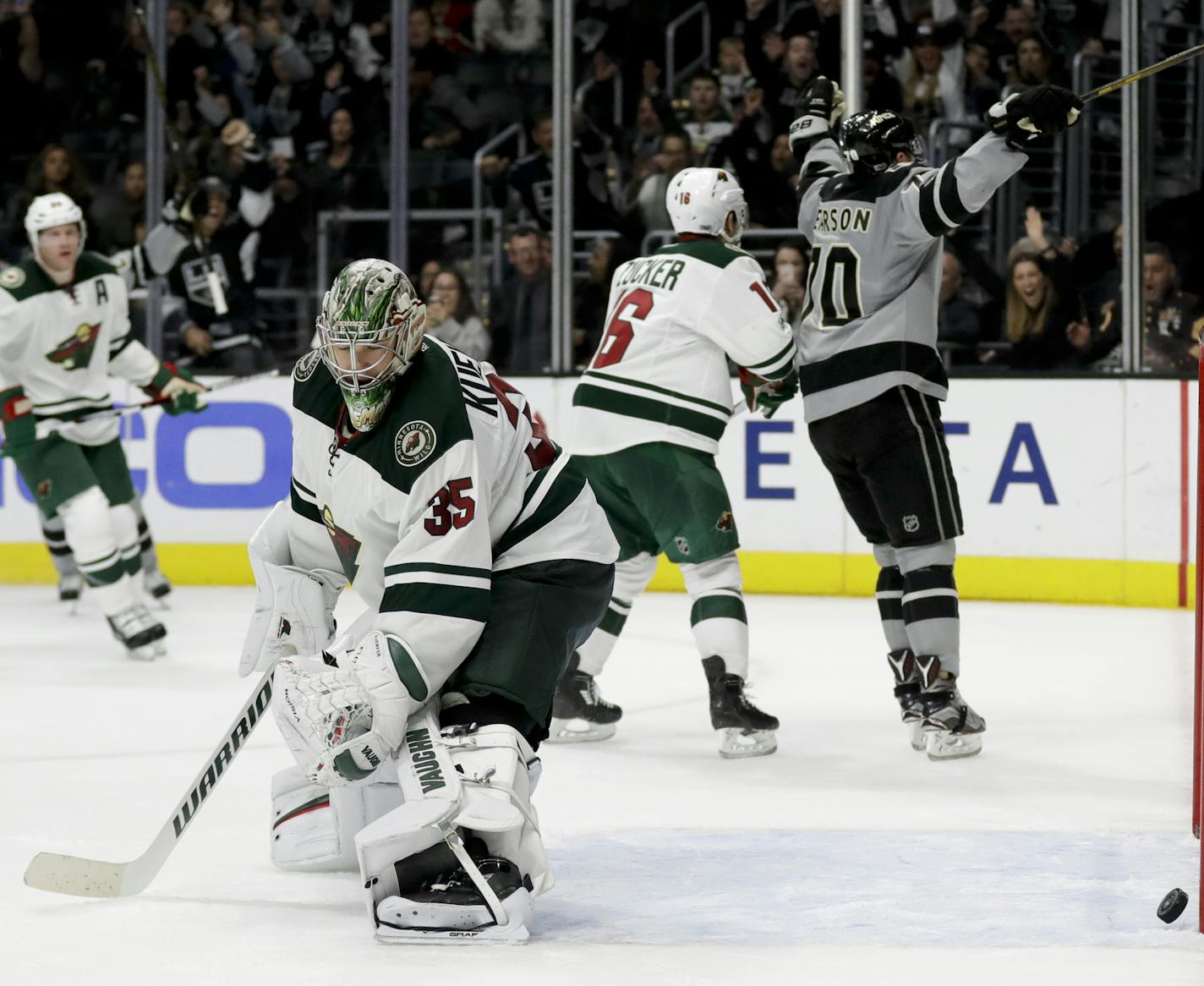 Minnesota Wild goalie Darcy Kuemper reacts after Los Angeles Kings left wing Tanner Pearson scored the game winning goal during overtime in an NHL hockey game in Los Angeles, Saturday, Jan. 7, 2017. The Kings won 4-3 in overtime. (AP Photo/Chris Carlson)