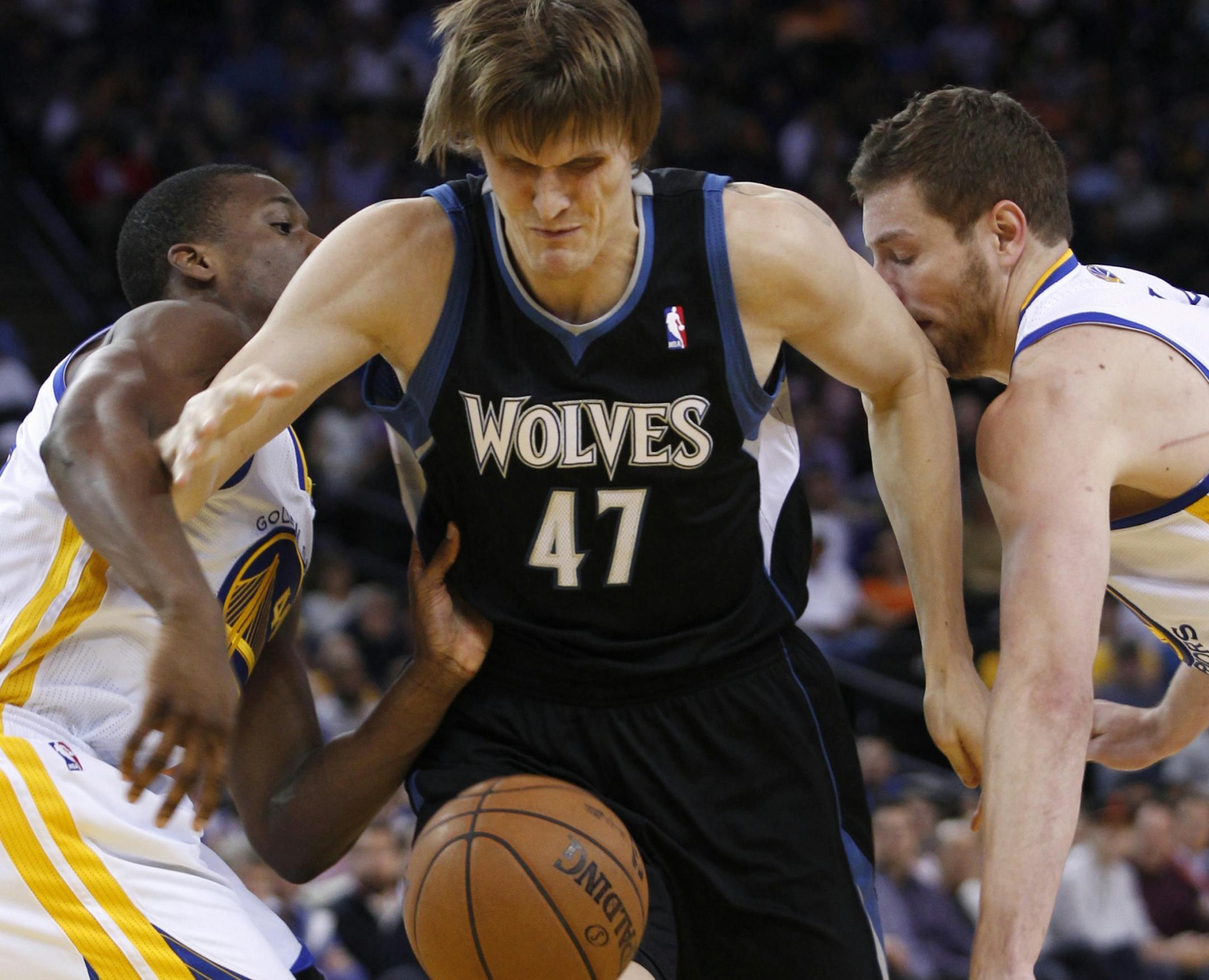 Minnesota Timberwolves' Andrei Kirilenko (47) loses control of the ball between Golden State Warriors' Harrison Barnes, left and David Lee during the first half of an NBA basketball game, Tuesday, April 9, 2013, in Oakland, Calif. (AP Photo/George Nikitin) ORG XMIT: MIN2013041009111812