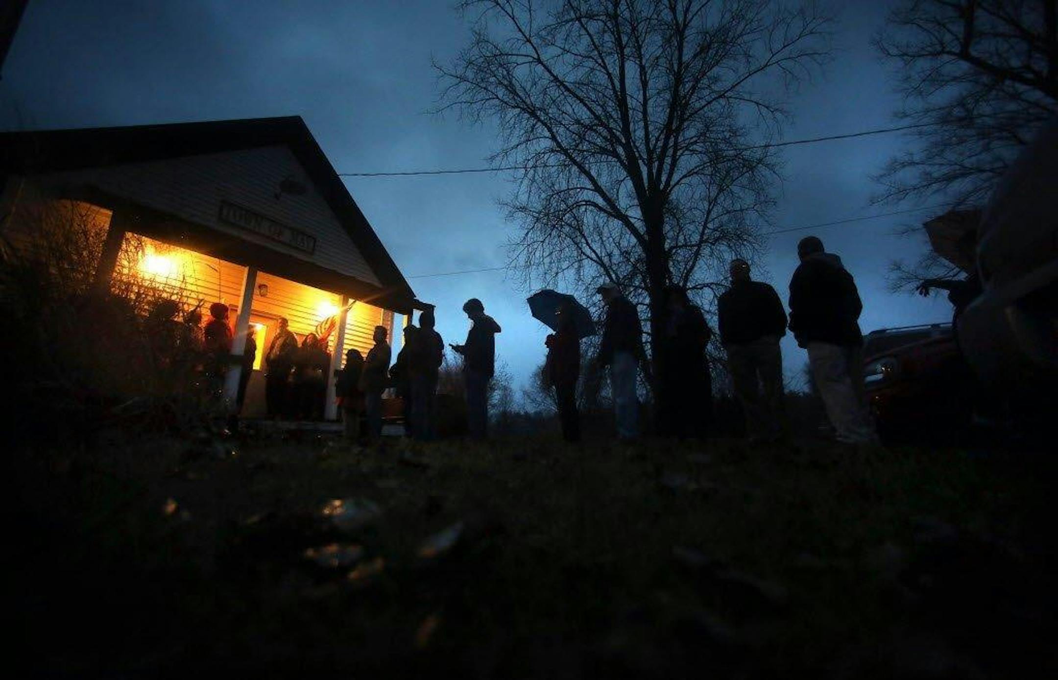 Voters waited in the rain for their precinct to open at the May Town Hall on Nov. 6, 2012.