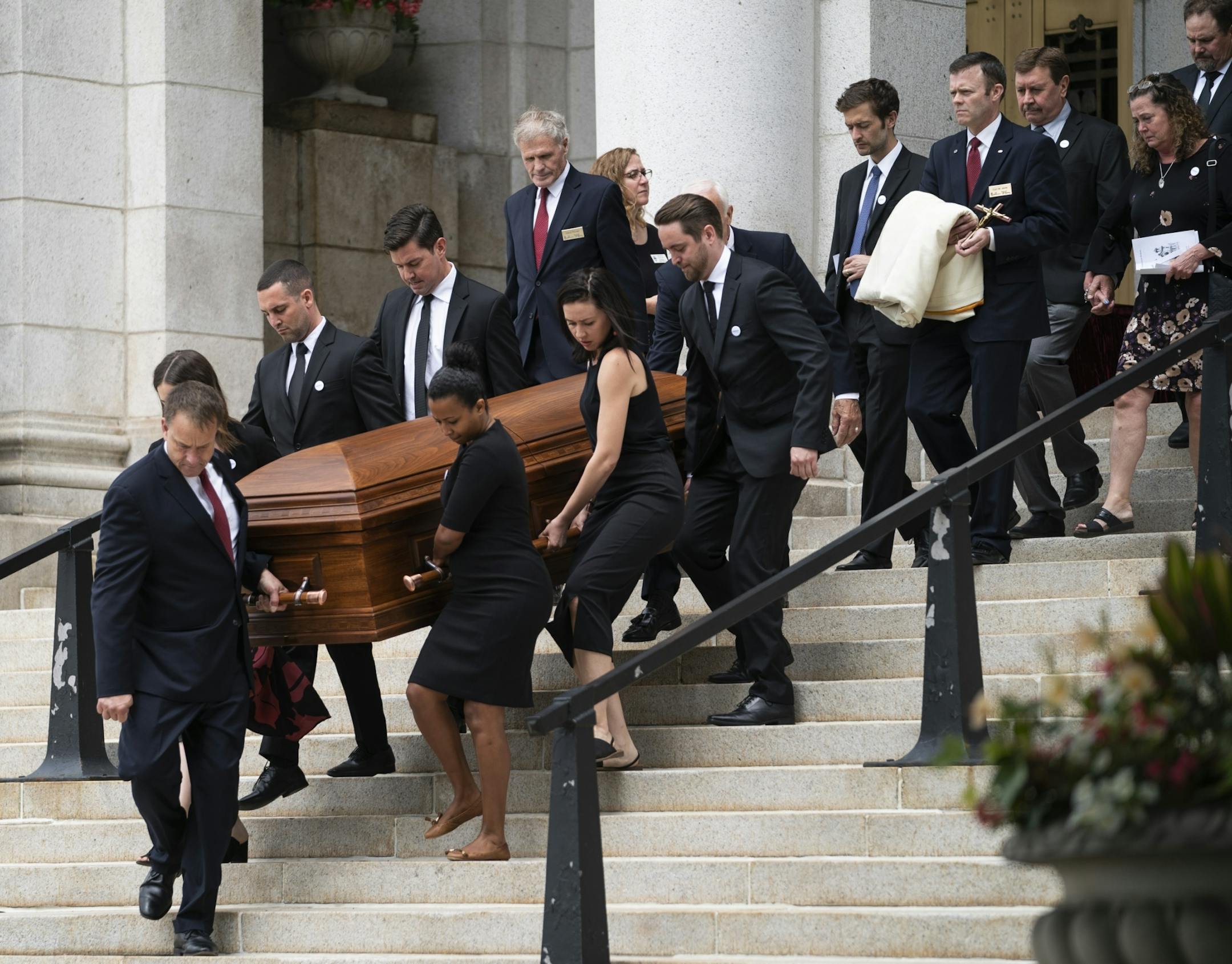 Friends and family carried and followed the casket of Gabriele Grunewald at her funeral at the Basilica of St. Mary in Minneapolis.