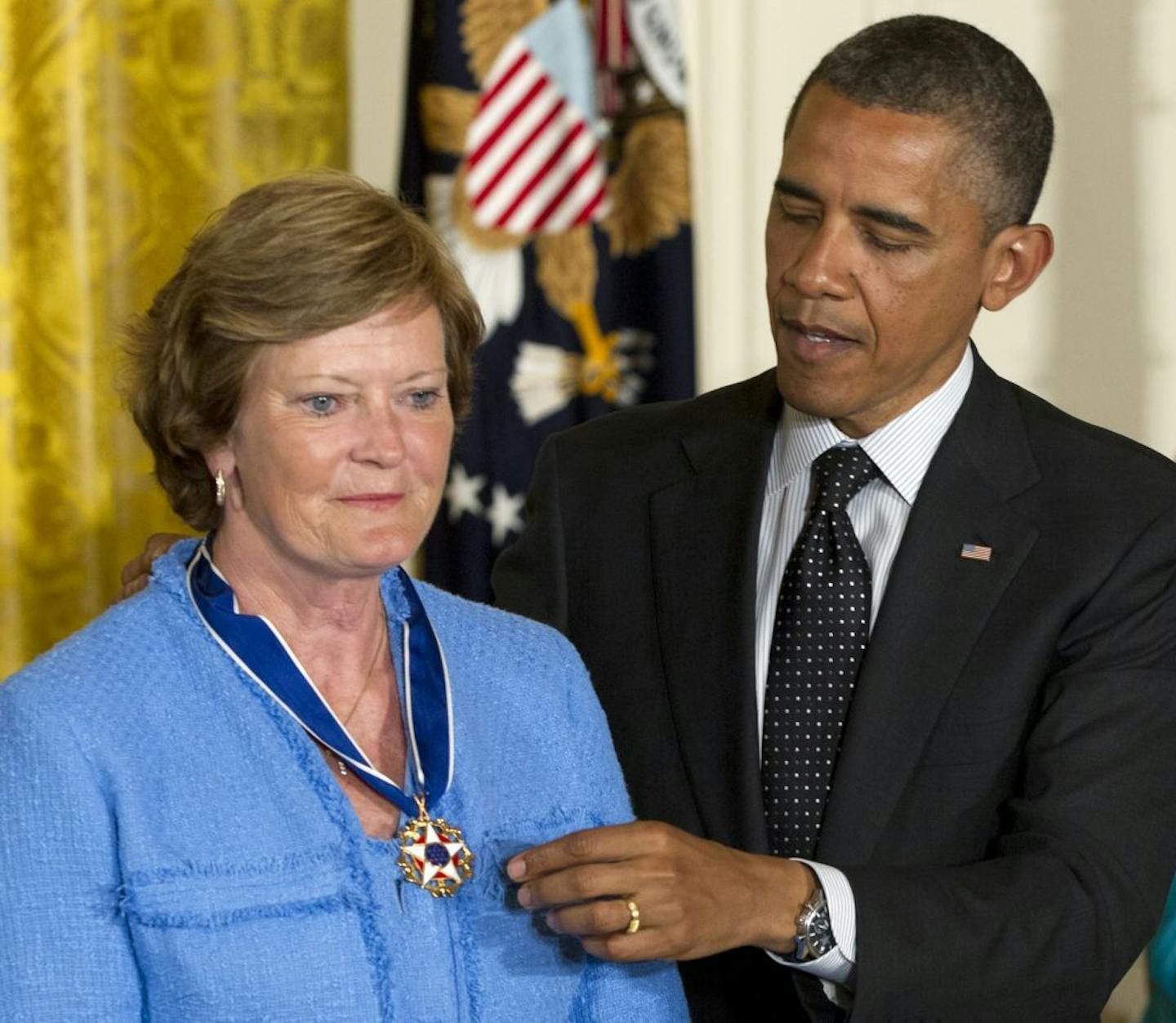 FILE- In this May 29, 2012, file photo, President Barack Obama awards Pat Summitt, former Tennessee basketball head coach, the Presidential Medal of Freedom in the East Room of the White House in Washington. Summitt, the winningest coach in Division I college basketball history who uplifted the women's game from obscurity to national prominence during her career at Tennessee, died Tuesday morning, June 28, 2016. She was 64.