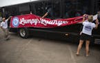 A group of Tim Herron fans raise a "Lumpy's lounge" sign on their bus that comes out to PGA tour events occasionally to support Herron. ALEX KORMANN &