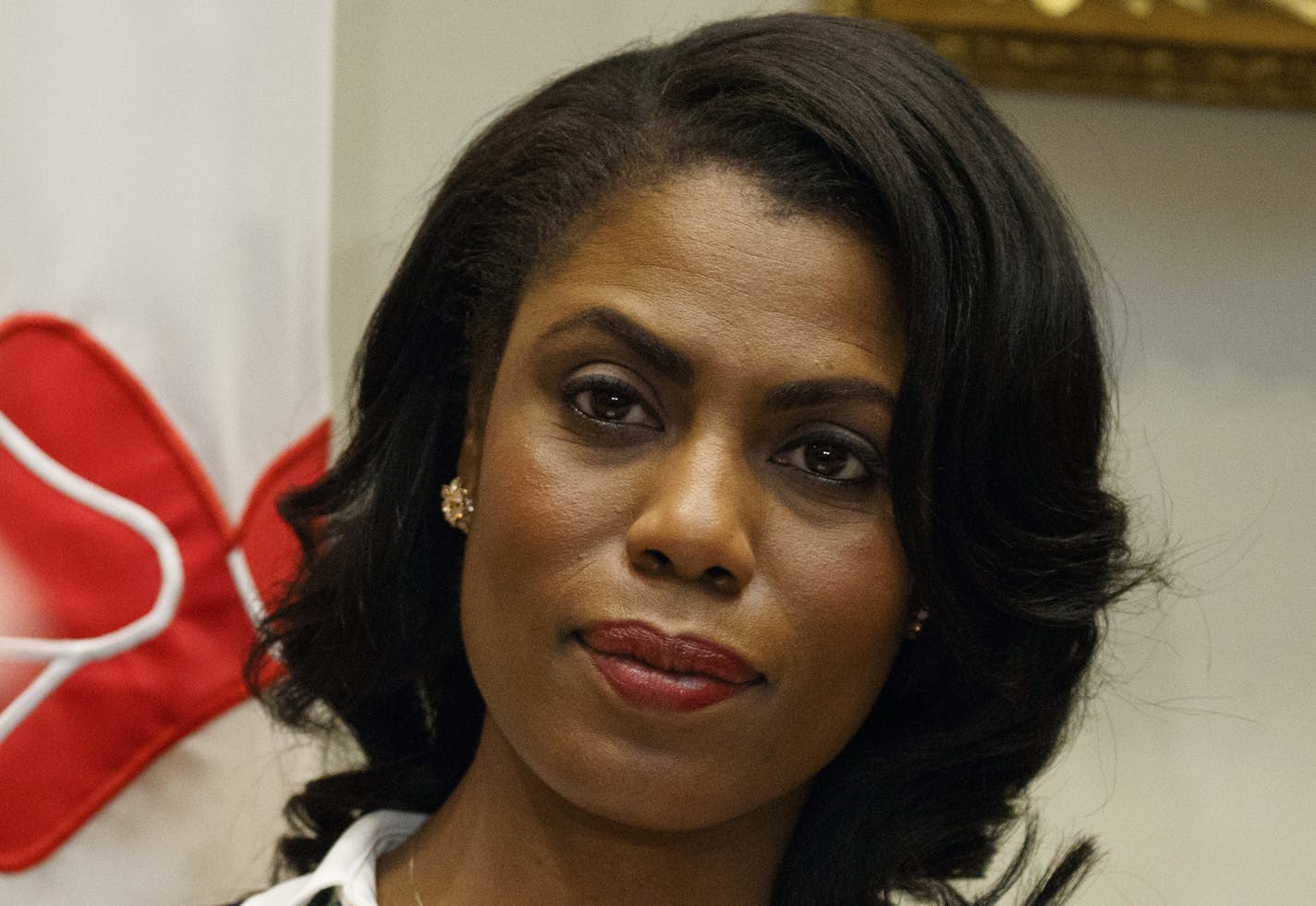 FILE - In this Feb. 14, 2017, file photo, Omarosa Manigault-Newman, then an aide to President Donald Trump, watches during a meeting with parents and teachers in the Roosevelt Room of the White House in Washington.