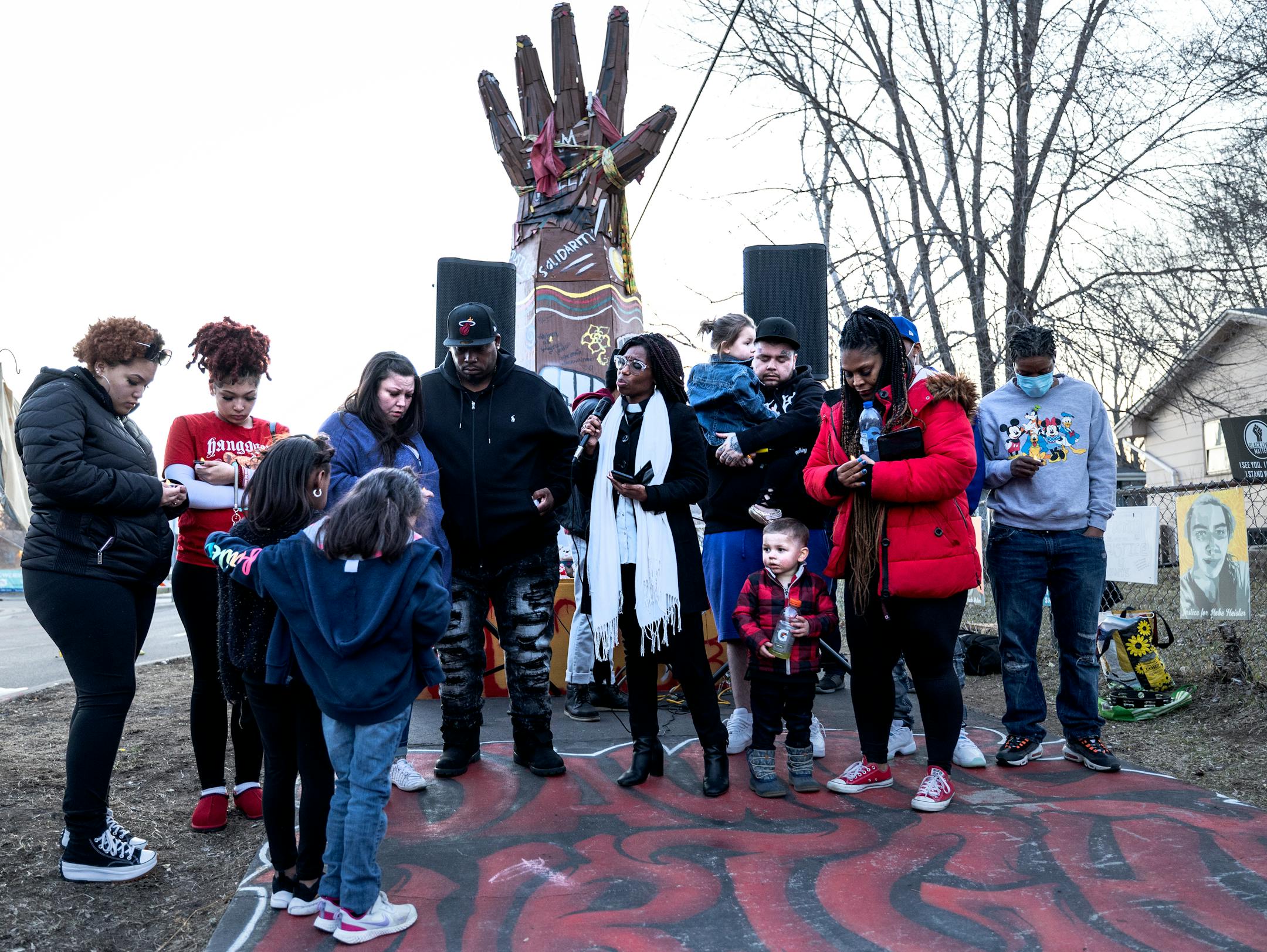 The family of Daunte Wright gather for a moment of prayer at a Vigil honoring Wright on one-year anniversary of his death Monday, April 11, in Brooklyn Center, Minn.