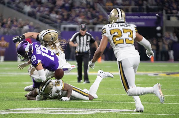 Saints cornerback Marshon Lattimore (23) closed in to recover a fumble by Vikings wide receiver Adam Thielen (19) late in the second quarter, one of t