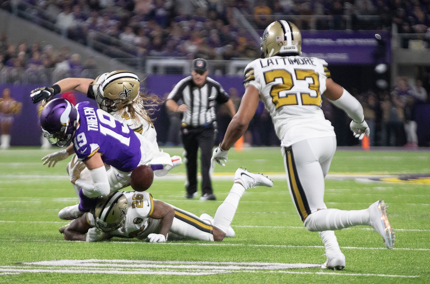 Saints cornerback Marshon Lattimore (23) closed in to recover a fumble by Vikings wide receiver Adam Thielen (19) late in the second quarter, one of two costly Minnesota turnovers Sunday night.