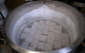 In this Tuesday, Oct. 2, 2018 photo, containers holding frozen embryos and sperm are stored in liquid nitrogen at a fertility clinic in Fort Myers, Fl