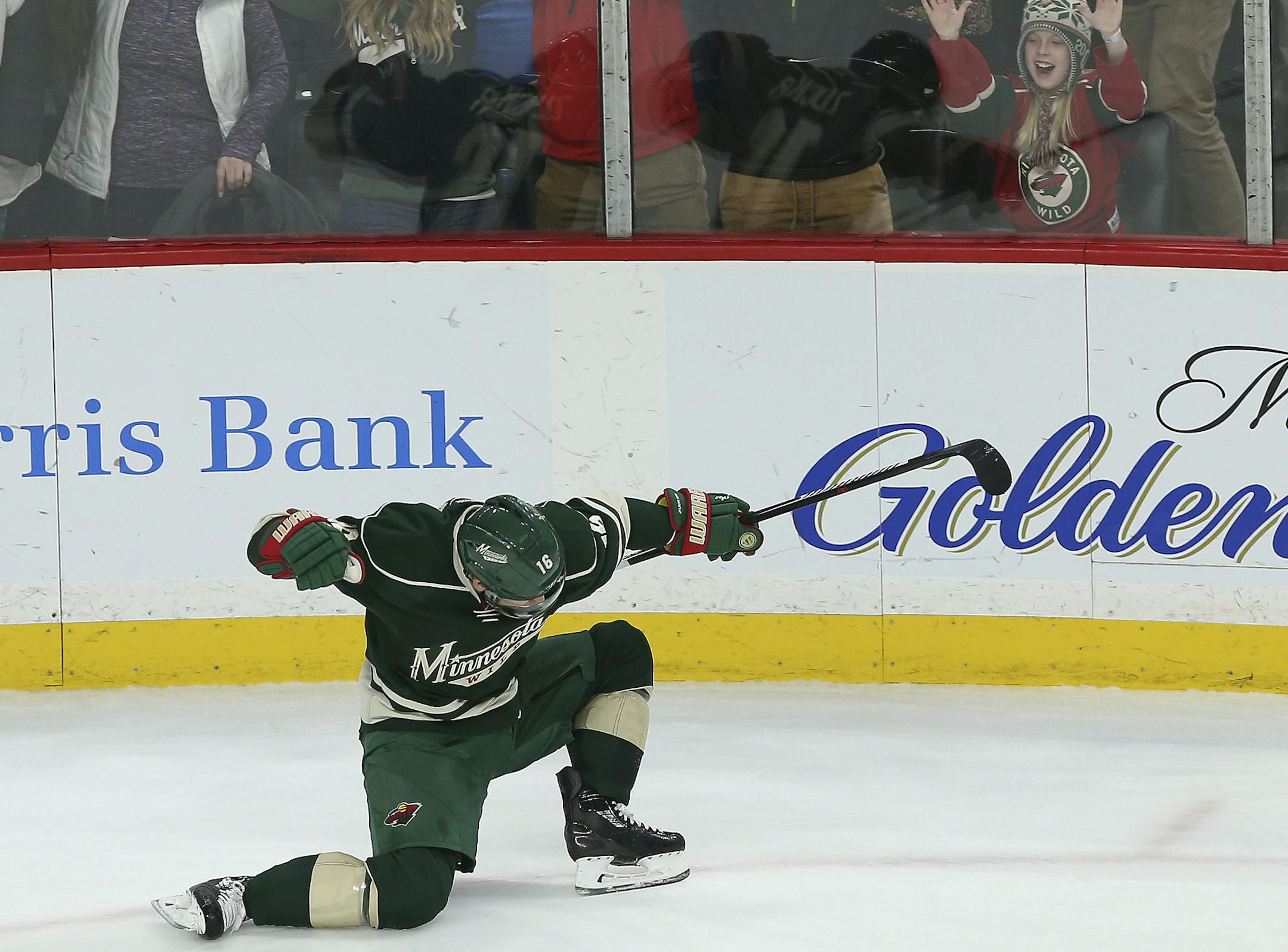 Minnesota Wild's Jason Zucker celebrates after scoring a goal against the Anaheim Ducks during the third period of an NHL hockey game Saturday, Jan. 21, 2017, in St. Paul, Minn. The Wild won 5-3. (AP Photo/Stacy Bengs)