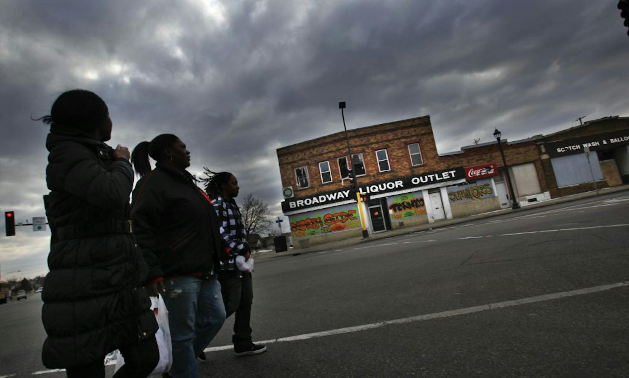Last month, ominous clouds scudded past the abandoned Broadway Liquor Outlet, which was ravaged by last year's tornado.