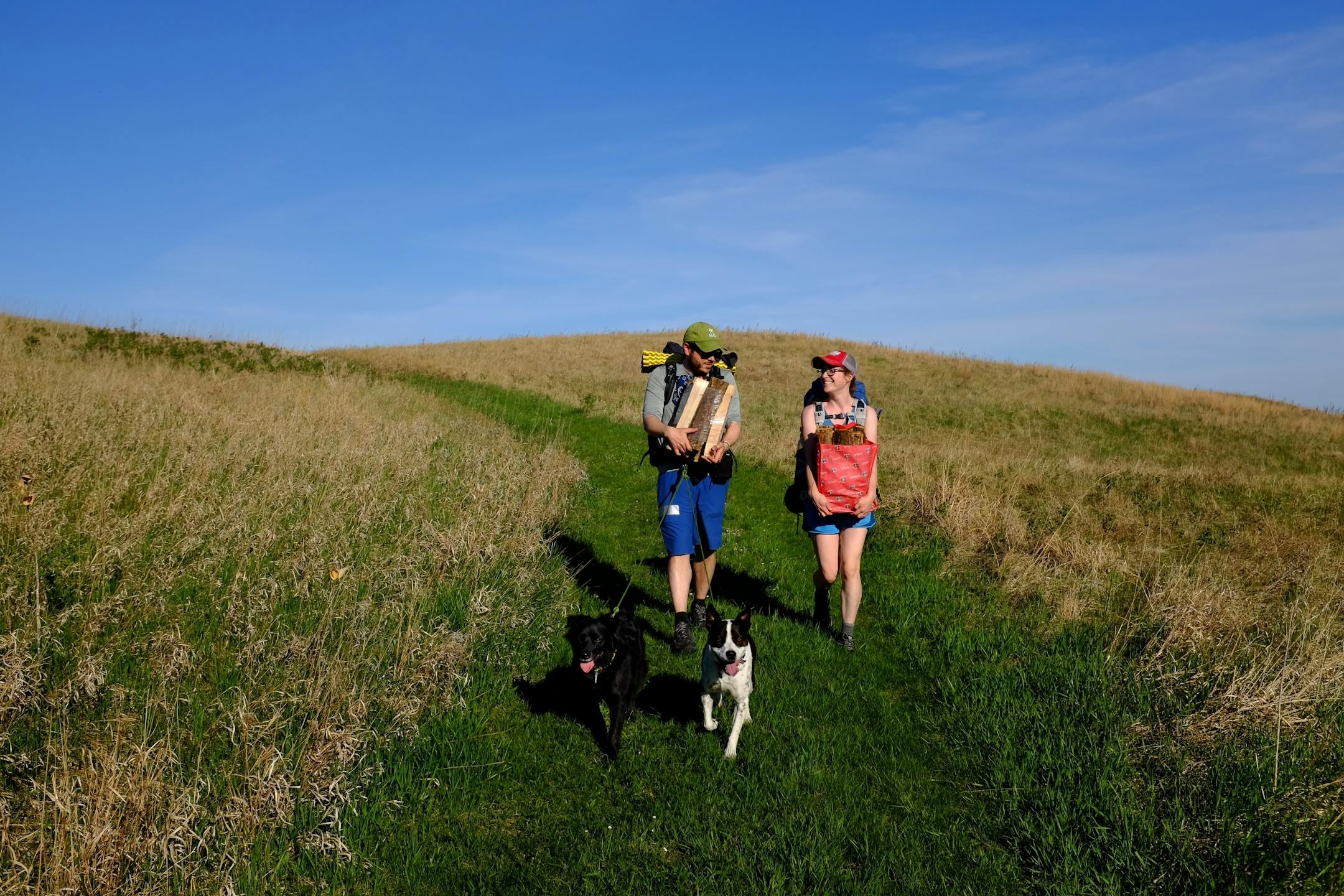 Anthony and Genna Souffle carried firewood from their backcountry campsite at Baby Lake to the Hill campsite two miles away. Their plans changed after being inundated with ticks at Baby Lake, forcing them to move spots.