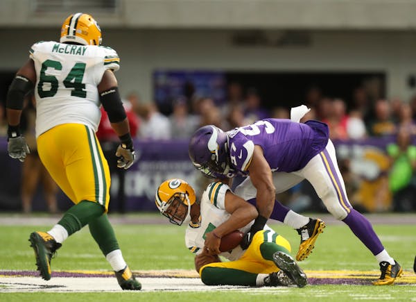 Minnesota Vikings defensive end Everson Griffen (97) sacked Green Bay Packers quarterback Brett Hundley (7) for a six yard loss in the fourth quarter.